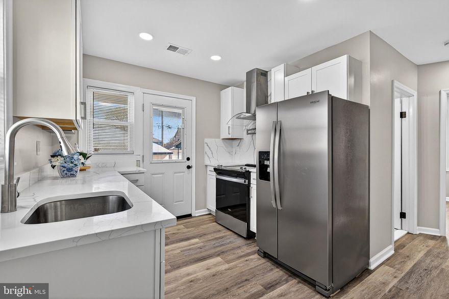 Welcome to this beautifully updated Cape Cod in Baltimore County offering space, functionality, and modern finishes throughout! This 5-bedroom, 3.5-bath home features a thoughtfully designed layout with the convenience of main-level living. The main floor includes two bedrooms, including a primary suite, along with two full bathrooms. Enjoy a stunning open living area highlighted by a sleek media wall with an electric fireplace, perfect for relaxing or entertaining. The gourmet kitchen is a true showstopper, featuring quartz countertops, a range hood, and a matching quartz backsplash, complemented by brand-new flooring throughout the home. Upstairs, you’ll find an additional generously sized bedroom along with a versatile space ideal for a home office, playroom, or recreation area. The fully finished basement offers even more living space with two additional bedrooms, one full bathroom, a recreation area, and a walkout exit, perfect for guests or extended living. Washer and dryer are included.
Step outside to a spacious backyard and fully fenced backyard featuring a large detached two-car garage with extra storage and a convenient half bathroom, ideal for a workshop, hobby space, or additional functionality. The property also offers 2 extra parking next to the garage for multiple vehicles. 
Located between Sparrows Point and Edgemere, this home combines comfort, flexibility, and value, don’t miss the opportunity to make it yours!
