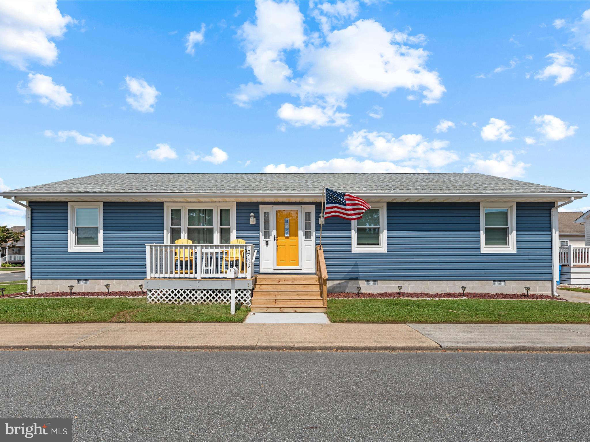 This updated coastal rancher offers a warm welcome from the moment you arrive, starting with its newly built front porch (March 2025) and storm door (March 2025), perfect for catching ocean breezes and enjoying the relaxed pace of life here. Step inside to a bright and inviting living room, where glowing oak hardwood floors and a spacious layout create the ideal gathering place for family and friends. The open flow leads seamlessly into the dining area, bathed in natural light and generously sized for both casual meals and lively entertaining.
The adjacent kitchen (updated in March 2019) combines style and function with 42-inch soft-close cabinetry, granite countertops in coastal hues, stainless steel appliances, a double sink with gooseneck faucet, and a charming pendant-lit window over the sink. Off the kitchen, a generously sized bedroom features hardwood flooring, a ceiling fan, and space for two queen beds. This room could also be used as an office. Nearby, the laundry room offers a front-load washer and dryer on storage pedestals, a utility closet, and direct access to the side deck.
A hallway with parquet wood flooring leads to the home’s two updated baths, a hallway bath refreshed in January 2021, and a primary suite bath renovated in 2018. The private primary bedroom is tucked away at the rear, offering crown molding, soothing neutral tones, and an en suite with a solid-surface vanity, tiled shower with glass doors, and a ceiling heat lamp (also found in the hallway bath) for cozy mornings.
Recent upgrades ensure peace of mind, including a new roof (May 2020), new siding and HVAC system (February 2021), new windows (December 2017), and an encapsulated crawl space (October 2017). A new hot water heater (March 2019) adds further efficiency and reliability.
Outdoor living is equally appealing, with a wraparound deck accessible from both the dining area and laundry room, ideal for relaxing, grilling, or entertaining. The spacious corner lot offers room to garden or play, along with a storage shed and private driveway.
Perfectly located within walking distance to Harpoon Hanna’s and minutes from Fenwick Island and Ocean City beaches, this delightful beach home blends thoughtful updates, timeless charm, and unbeatable convenience.