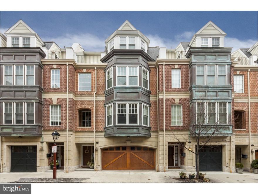 Expansive 27ft. wide townhouse in prestigious Liberty Court in Society Hill. Conveniently located to the famous Headhouse Square Farmers market, Philadelphia's Best Restaurants, Lovely parks, and easy access to bridges and highways, 2 car attached garage with interior access,  Elegant wood paneled elevator serving all 4 floors. 1st floor features spacious family room with Pappjohns custom millwork bookcases and entertainment center, powder room and door to rear patio garden. 2nd floor features fabulous Cook's kitchen with Viking appliances, including commercial 48-in gas range with double ovens, griddle and integrated hood. 8 ft island/breakfast bar, granite countertops and handsome Brookhaven cabinets, sliders open out to a rear deck, large food pantry, powder room, Spacious living room/dining area with 10 ft. ceilings, broad bay window overlooking the picturesque City streetscape, beautifully designed lighting, Spark Modern ventless gas fireplace built into beautiful custom cabinetry, rich Mahogany floors. The 3rd floor is brilliantly conceived, with spacious bedroom custom built-in bookcases, small private in-home office, fabulous walk-through closet/dressing room with Closet-Concepts built-ins, and exquisitely detailed master bathroom with limestone tile, convenient laundry room with custom shelving. The 4th floor offers two roomy bedrooms, one with lovely built-in window seat offering skyline views, each with custom organized closets, two decks, and beautiful hall bath.  Approximately three years remain on the tax abatement.  Showings by appointment only.