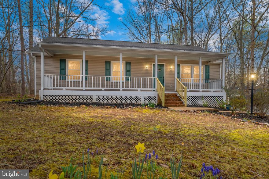 Nestled in a peaceful cul-de-sac, this charming one-level retreat is perfect for nature lovers seeking a serene, rural escape with all the comforts of home. The rocking chair front porch invites you to relax and soak in the tranquil surroundings before stepping inside to a spacious cathedral ceiling living room, where natural light pours in, creating a warm and inviting atmosphere.

The heart of the home is the well-appointed kitchen, featuring granite countertops, stainless steel appliances, and a dining area perfect for gathering with loved ones. The vaulted ceiling primary suite offers a private oasis with an ensuite bath, while two additional bedrooms and a full bath provide ample space for family or guests.

Step outside onto the deck to enjoy your morning coffee, host a barbecue, or simply unwind while taking in the beauty of the outdoors. A shed offers extra storage for all your outdoor gear.

Located in a sought-after community, this home provides access to an array of amenities, including a lake, swimming pool, tot lot, tennis and basketball courts, and much more—all while being surrounded by nature’s beauty. Don’t miss this rare opportunity to enjoy peaceful living with the perks of an amenity-rich neighborhood!