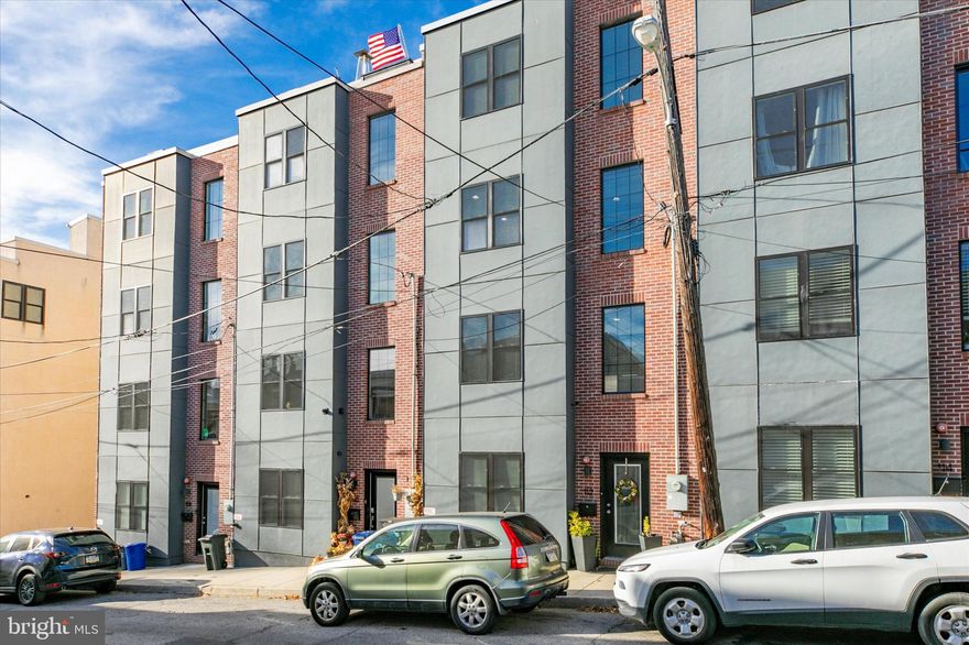 Built in 2016, 112 Kingsley Street offers the kind of modern living that makes older homes a little jealous. This beautifully designed Manayunk residence pairs stylish finishes with everyday practicality, featuring a coveted 2-car garage, sleek modern kitchen, and thoughtfully updated bathrooms throughout. The primary suite adds another level of comfort with a spacious walk-in closet, giving you the kind of storage that feels almost suspiciously generous. 

Upstairs, the showstopper is the stunning roof deck — the perfect spot for morning coffee, sunset unwinding, or casually pretending you are the type of person who hosts rooftop gatherings every weekend. Either way, it is a true bonus space that adds both lifestyle and wow factor. Combined with the home’s contemporary layout and polished finishes, the overall feel is clean, elevated, and move-in ready, without sacrificing warmth or livability. 

And then there is the location: tucked into one of Philadelphia’s most beloved neighborhoods, 112 Kingsley Street is within easy walking distance of Main Street Manayunk, known for its dense mix of shops, restaurants, and nightlife.  In other words, your weekends can be very productive, assuming your definition of productivity includes coffee, cocktails, and not needing to move your car. Main Street Manayunk is widely described as the neighborhood’s central dining and shopping corridor, with hundreds of businesses concentrated there