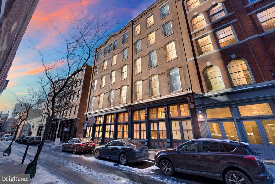 Tucked away on a peaceful street between Chestnut and Market Streets, Letitia Street is home to the Blackhorse Condominiums, a boutique condo building housed in a historic former meat processing facility. Unit #403 offers a bright, spacious, and meticulously maintained living space with hardwood floors throughout. The kitchen features stainless steel appliances and earth-toned stone countertops, while the living area is highlighted by large, divided light windows with custom blinds and a wood-burning fireplace flanked by built-in bookshelves.

Both generously-sized bedrooms offer custom closet shelving for maximum storage. The bathroom and kitchen both boast wood cabinetry that complements the hardwood floors. No carpet—just ceramic tile and hardwood throughout the unit. For added convenience, a stackable washer and dryer are located in the bathroom. The walls are painted in a neutral tone, creating an open, airy feel.

Additional storage is available in the basement, and residents can enjoy a spacious shared roof deck with furniture and sweeping views of the Ben Franklin Bridge, the Delaware River, and Christ Church Steeple. Just a short stroll away, you'll find some of Philadelphia’s best dining spots and green spaces in America’s most historic square mile.

Old City offers a rich cultural lifestyle, featuring spas, parks, art centers, bistros, cafes, and over 80 restaurants and 55 art galleries, making it the birthplace of the Restaurant Renaissance. Whether you're in the mood for fine dining or a classic Philly cheesesteak, you'll find something to suit your taste. The area is constantly evolving, with a pedestrian-friendly renovation of Market Street (between 2nd and 6th) set to complete by 2026. Additionally, a highly anticipated project is underway to cap a section of Interstate 95, creating nearly 12 acres of parkland and a seamless connection to the Delaware River waterfront at Penn’s Landing.

Come experience the vibrant life of Old City Philadelphia, where history, culture, art, food, and architecture combine to create an unforgettable atmosphere. This location is easily accessible to all parts of the city, nearby suburbs, New Jersey, and Delaware via bus, subway, train, or airport. Don't miss out on this affordable condo—schedule your appointment today!