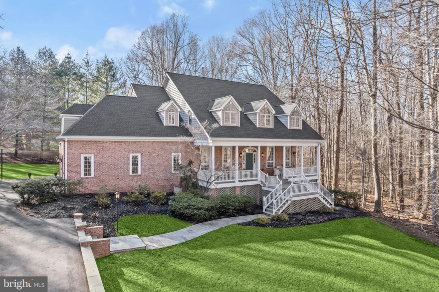 This very special home greets you with  quintessential Southern-style design, featuring a stately covered front porch with dual staircases that provide a warm and welcoming atmosphere for family and friends. The entry door, highlighted by an arched transom and sidelights, opens to a grand foyer, flanked by formal living and dining spaces defined by graceful arched cased openings.
The heart of the home is the Cook’s and Baker’s kitchen, which boasts a commanding wrap-around island, breakfast bar, pantry, and a planning station. An atrium door offers easy access to the rear deck, making outdoor dining and entertainment a breeze. The octagonal breakfast nook is bathed in natural light, creating a perfect spot for morning meals.
The main level also features a half bath and laundry chute in the well-appointed laundry center, along with a secondary staircase for added convenience. The spacious family room, located off the kitchen, is anchored by a gas fireplace flanked by built-in shelves. Atrium doors lead to the rear deck, offering an ideal space for outdoor relaxation. A bright and inviting sunroom with a wet bar and an atrium door further extends your living space to the wrap-around deck.
The main level also includes a private study and an adjacent full bath, offering the flexibility to become a main-level bedroom if desired.
Upstairs, five spacious en-suite bedrooms await, including a light filled primary suite with a separate sitting room and a spa-like bathroom featuring a jetted tub and separate water closet. Four additional secondary bedrooms, two on each wing of the upper floor, provide ample space for family and guests. A cozy reading nook on the landing between the wings adds a special touch.
The walk-out lower level is a true entertainer’s paradise, offering a sixth bedroom, cedar closet, and a full bath. The expansive recreation room is perfect for movie nights and gatherings, while the wet bar, billiards area, and exercise room provide additional space for fun and fitness. Full daylight windows ensure this level is bright and airy.
Situated on a tree-fringed, wooded lot, this home offers spectacular indoor and outdoor living venues for gatherings of all sizes. With Southern charm, lifestyle flexibility, and an abundance of amenities, this home is truly one-of-a-kind. Don’t miss the opportunity to experience and love this remarkable property!