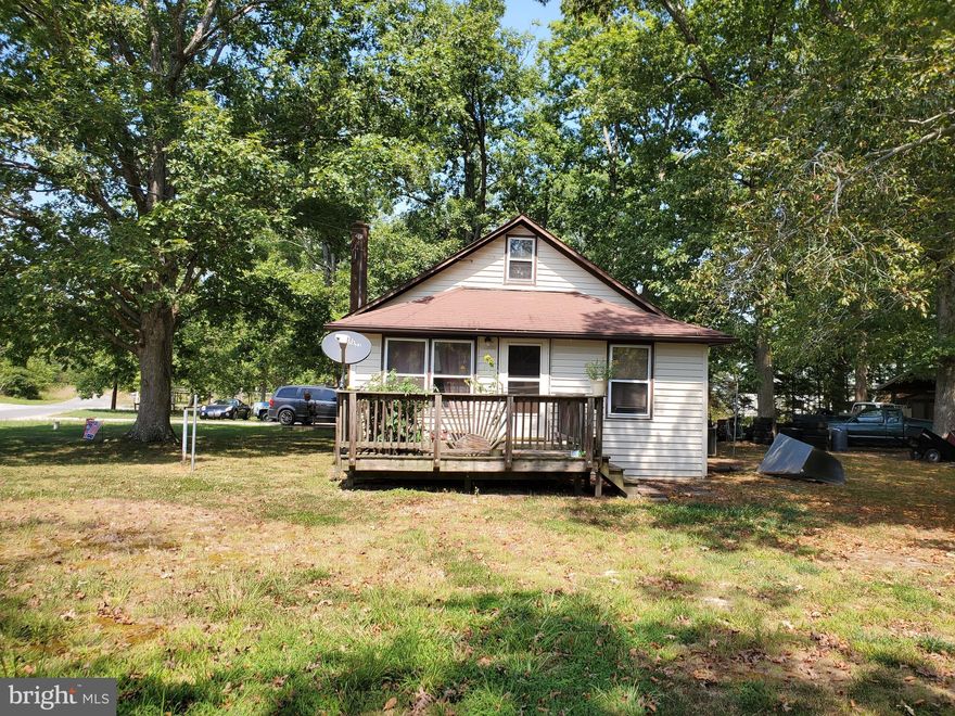 This quaint home was previously used for the share croppers. Plenty of room on the 1.16 acres to expand the house or build a new one! The garage is 24'x24' and can hold 6 cars stacked side by side. The garage is wired for an air compressor & for the generator for the house. (air compressor & generator do not convey) The driveway has been reinforced to be able to withstand the weight of a large pickup truck with a large enclosed trailer. Third party approval required.