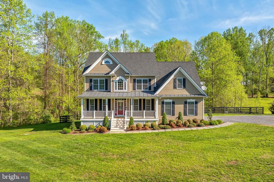 Welcome to 9480 Piney Mountain Road—a stunning modern farmhouse tucked away on over 5.5 serene acres in the heart of Virginia’s renowned hunt country. Featuring 4 spacious bedrooms and 3.5 bathrooms, this elegant home offers timeless style, a thoughtful layout, and picture-perfect surroundings including your very own private pond. From its classic front porch to the meticulously maintained interiors, this property blends charm, function, and sophistication in perfect harmony.

Step inside to a soaring two-story foyer with gleaming hardwood floors that flow throughout the main level. The light-filled living room offers a warm, inviting space to unwind or entertain, while the formal dining room is a showpiece of refined detail—complete with crisp crown moldings and a statement-making orb chandelier. The heart of the home is the chef-inspired kitchen, boasting granite countertops, handcrafted cabinetry, and premium stainless steel appliances—including a gas cooktop with a sleek, suspended hood. Whether you're enjoying breakfast at the peninsula bar, sipping coffee by the bay window, or lounging in the adjacent family room, this space is built for connection and comfort. A well-designed mudroom with built-ins and a stylish powder room add everyday convenience.

Upstairs, the luxurious primary suite invites relaxation with its tray ceiling, cozy sitting area, generous walk-in closet, and a spa-like en suite bath featuring dual granite-topped vanities, a deep soaking tub, and a frameless glass shower. Three additional bedrooms share a beautifully designed dual-entry bath with separate vanity space—ideal for busy mornings. A full laundry closet with updated machines completes the upper level. The finished walkout lower level offers even more versatility: a spacious recreation room perfect for movie nights or game days, a full bath, and a flexible bonus room ideal for guests, a home office, or gym. There's also abundant storage to keep everything neatly tucked away.

Outside, the peaceful acreage, lush lawn, post-and-rail fencing, and scenic pond provide the ultimate backdrop for outdoor living and entertaining. Though surrounded by nature, you’re just minutes from the shops, dining, and charm of downtown Warrenton, with easy access to Washington D.C., Fredericksburg, and beyond. This is more than just a home—it’s your own private retreat. Discover timeless design, modern comfort, and the beauty of country living at 9480 Piney Mountain Road. Welcome home!