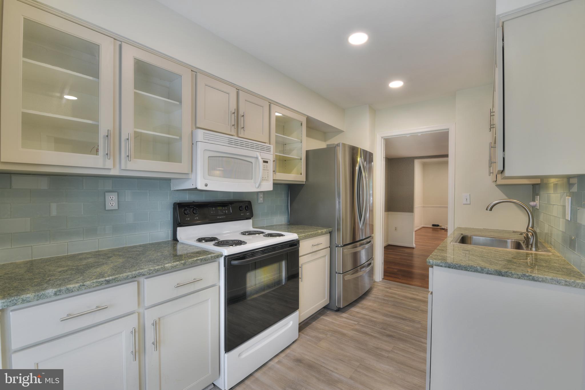 The sellers reason for going temporary off market was 100% for updates!
Updates include: Primary Bath Vanity and Lighting, New Toilets throughout, Recessed Lighting throughout, New Light Fixtures in hallways and laundry, fresh paint throughout including ceilings and all trim.
Fall in love with this beautifully updated, move-in ready townhome in the highly desirable Tanglewood at Bay Hills community in Arnold!
From the moment you step inside, you’ll notice the recent updates and charming details throughout. Enjoy peace of mind with a brand-new roof (2023), a stylishly updated kitchen (2023), and a large, sun-filled bay window (2023) that brightens the space.
Gleaming bamboo hardwood floors and classic wainscoting create a warm, welcoming atmosphere, while fresh neutral paint throughout offers a clean, modern canvas for any décor style.
The galley kitchen is both functional and bright, with room for a sunny breakfast nook. A convenient main-level powder room and spacious living area flow seamlessly to your private deck—perfect for grilling, entertaining, or enjoying the peaceful view of the shared green space.
Upstairs, the primary suite offers two closets and a beautifully updated en suite bath. Two additional bedrooms and a full hallway bath with new toilets provide flexibility for guests, family, or a home office.
Downstairs, the fully finished lower level offers even more living space, featuring a cozy family room with a corner brick fireplace and walk-out access to the deck and back patio.
Additional perks include new recessed lighting in multiple rooms, two assigned parking spaces (labeled “486”), and plenty of guest parking throughout the neighborhood.
With its fresh updates, comfortable layout, and unbeatable location close to shopping, dining, and commuter routes, this townhome is ready to welcome you home!