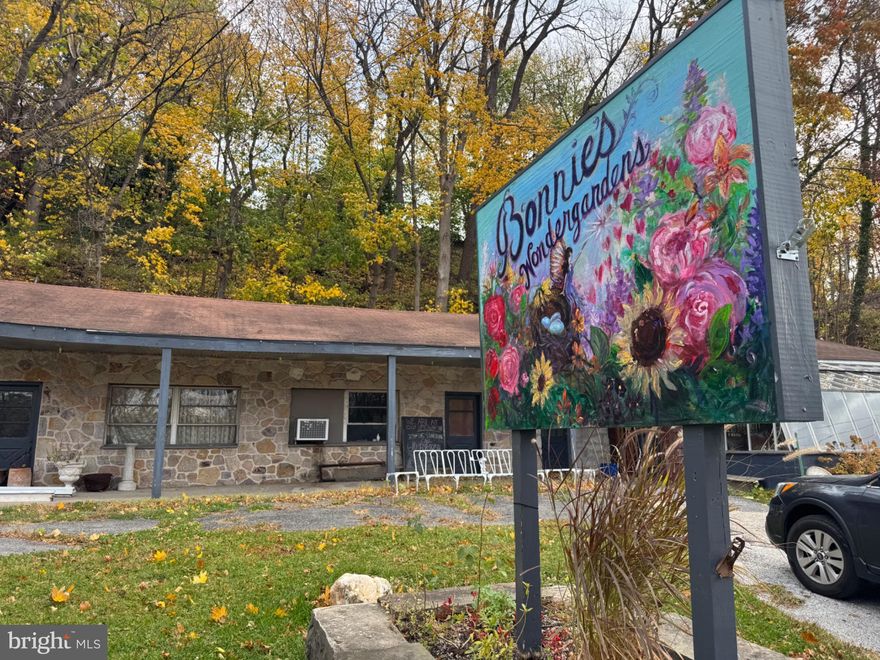Imagining the new Gateway to Lansdowne! Prime redevelopment opportunity along Darby Creek in Lansdowne Borough. This 1.53-acre parcel, zoned Residential (R-1 with a legal non-conforming retail use, was formerly a neighborhood flower shop. Its flexible layout, creekside setting, and proximity to Gladstone SEPTA Station make it ideal for residential, recreational, or restaurant concepts serving nearby trails and parks. Public utilities available. Largely outside the 100-year floodplain. Convenient to Baltimore Avenue, major highways, and Center City Philadelphia—233 Scottdale Road offers location, visibility and potential in one unique site.
