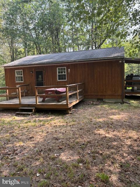 Situated on 14.5 acres, this off grid Centre County property is great for hunting, hiking, for your family getaway to escape to nature. Ride from your property to the Snow Shoe Rails to Trails system. Cabin offers two bedrooms, woodstove for those cold winter evenings. Hand pump well on property for your water needs. Enjoy large fire pit, great for making S'mores. Camp is serviced by an outhouse.
