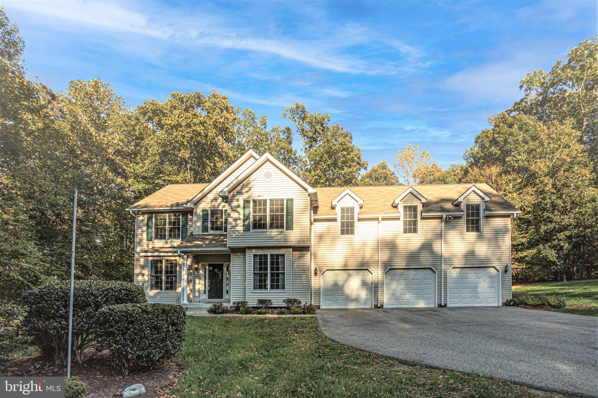 BIG BOLD BEAUTY!! Peace and Tranquility abound at this expansive home on 3.82 Acres of private wooded land! This nicely appointed home features lots of natural lighting throughout its large rooms. You are welcomed by a soaring foyer ceiling and gleaming hardwood floors. If you are telecommuting to work, you may enjoy the formal living room that could double as an office area. You can entertain in style with the kitchen that opens to family room and large double level deck complete with a built-in firepit â just in time for those chilly fall evenings! Food prep is a snap with the convenient granite topped island with downdraft gas cooktop! A large pantry offers plenty of storage, as well as a closet in the mudroom. The cheerful laundry room has built-in shelving and clothing hanger areas, and it comes with pedestal front-load washer and dryer. There is a formal dining room for those larger gatherings you may host with plenty of room for everyone. The Upper level offers a huge primary bedroom with en-suite primary spa-like bath with separate tub and remodeled oversized shower with clear seamless glass doors. There are 3 other good-sized bedrooms on the upper level and a large hall bathroom. The 4th bedroom is an oversized room with built in shelves and countertops, window seat with extra storage, double closets and a door that opens to a stand-up huge attic storage area! This could be a fantastic upper-level playroom or family/game room or crafting room â the ideas are endless! This home also features a finished basement with plenty of storage and a den/tv area. The unfinished area gives plenty of space for storage as well, it even has built-in shelves. The yard is almost 4 acres of private treed landscape. Many updates including heat pumps, leaf guards, the kitchen refrigerator in the last few years and downstairs refrigerator within the last year. Roof, siding, soffits, gutters, shutters within last 10 years. There are Pella and Andersen windows throughout and exterior doors in kitchen, basement, front and garage side door all replaced within the past 3 years. All commodes have been replaced with the taller Kohler ones. There is an electrical rough in for a hot tub on the deck if you desire to place a hot tub there. The pellet-stove in the family room is thermostat automatic controlled. The location is great â easy access to commuting to Washington DC, National Harbor, Joint Base Andrews or Bolling or points south. Be sure check this one out!!