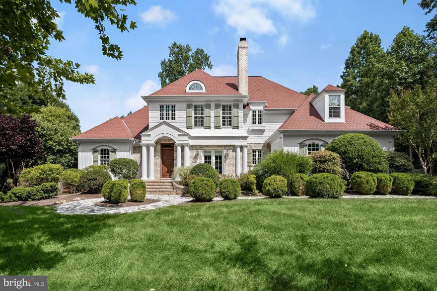 Welcome to The Woods of Wellington, one of Howard County’s most sought-after neighborhoods. 3205 Huntersworth is a custom-built architectural marvel that exudes high-quality construction, meticulously crafted with only the finest materials and finishes. Perfectly sited on 1.13 gorgeous acres, extraordinary design meets comfort in this expansive one-of-a-kind home; with 3 finished levels and an outdoor oasis, private resort-like living is afforded. Incredible attention to detail was employed to build the finest residence reminiscent of faraway places blending craftsman elements with traditional features. Pristine landscape architecture and lush grounds ensure privacy while integrating the property's great vision with its natural environment in the most beautiful way. Indoor-outdoor entertaining is seamless with grand but gracious French doors opening to the stunning exterior living spaces including an expansive composite deck and slate paver patio with pergola, each wonderful spaces for al fresco dining. Nestled on one of the community’s most secluded lots, enjoy the serenity of the surroundings in the captivating heated in-ground saltwater pool and spa with waterfall. If you’re in need of relaxation, the wood-planked barrel sauna will be your sanctuary. 
An awe-inspiring interior is introduced by the welcoming foyer with custom solid-wood door and transom window leading to the formal dining room with cozy fireplace and French doors. The opposite side of the foyer hosts the handsome study, painstakingly designed with built-in panoramic bookcases and cabinetry including a hidden bookcase door to the main level bedroom suite. Lovely details and architectural elements are at every turn, among them varied-width white oak hardwood floors, vaulted ceilings, intricate moldings, designer lighting, interior balcony, and generous room sizes that enhance the property. Walls of French doors and windows invite an inpouring of natural light, epitomized in the spectacular 2-story living room with soaring board and batten ceiling and clerestory windows. The main level continues with the wonderful gathering spaces including a family room off the kitchen and the gourmet kitchen itself offering premium cabinetry with display cabinets and custom range surround, granite counters, high-end stainless steel appliances, beverage refrigerator, center island with seating, prep sink and a casual dining space. Expertly delivering in both form and function is a varied use room off the garage with wall-to-wall built-in cabinetry with drop-zone, concealed washer and dryer, laundry chute, and sink. Concluding the main level is a bedroom with attached full bath, perfect as an in-law, guest, or nanny suite.  
Comprising the second floor of the main house is an exciting collection of 3 bedrooms and 3 full baths. The primary suite is its own paradise with two custom walk-in closets, and a luxury en-suite bath with separate granite counter furniture-style vanities, a modern freestanding soaking tub, and floor-to-ceiling tiled shower with rain head. The two additional bedrooms are equally impressive, highlighting walk-in closets and an en-suite bath. The walkout lower level presents an expansive recreation room with wet bar or second kitchen rough-in, media room, and an exercise room outfitted with mirrors. Additionally, the lower level hosts a fifth bedroom, full bath, storage, and utility rooms. The home is also outfitted with an attached, side loading 2 car garage with an electric vehicle charger, concealed under deck storage, generator, and fencing around the perimeter of the backyard. Impeccably designed, this home is an image of privacy, quality, and tranquility with everything you have been searching for.