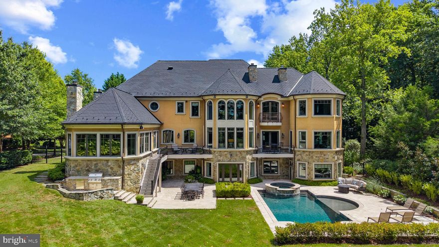 An extraordinary private waterfront estate, perfectly positioned on Church Creek with direct access to the South River—this offering is a rare blend of luxury, design, and location. Ideally located just minutes from Annapolis and convenient to both Washington D.C. and Baltimore, the home is masterfully designed for elevated everyday living and effortless entertaining, whether hosting an intimate gathering or a large-scale event. The saltwater pebble-sheen pool with integrated hot tub, and sun shelf creates a resort-style backdrop surrounded by professionally landscaped grounds and peaceful, water views. Inside, 6 bedrooms, 7 full baths, and 2 half baths are thoughtfully distributed across three finished levels.  With all bedrooms featuring ensuite baths this home offers flexibility, privacy, and exceptional craftsmanship throughout. Be sure to explore the hidden bonus room tucked away behind the built in bookshelf in the guest room closet! A custom-designed bar and expansive deck on the main level overlooks Church Creek and the poolscape, setting the tone for the home’s seamless indoor-outdoor lifestyle. The recently renovated walk-out lower level boasts a guest suite, full bath, living room, second bar, gym, laundry area, sauna, and ample storage—all with direct access to the backyard, water’s edge, and pool. A private pier with 8’ MLW, boat lift, and 157 feet of shoreline enhances the waterfront experience. A tree-lined driveway leads to a motor court and two separate 2-car garages—one attached, one detached—completing this exceptional estate.  Located in the ideal location for quickly accessing the South River or Chesapeake Bay by boat, heading by car to Historic Annapolis or hopping on Rt. 50 to get back to Washington, DC. Welcome Home!