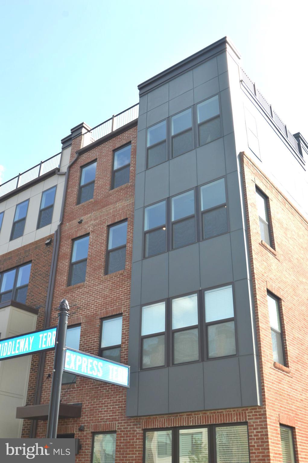 WITHIN WALKING DISTANCE TO ASHBURN METRO*BRICK FRONT LIGHT & BRIGHT END UNIT*OPEN FLOWING FLOOR PLAN THROUGHOUT*HUGE ROOF TOP TERRACE FOR ENDLESS ENTERTAINMENT*3 BEDROOMS, 2.5 BATHS & 1 CAR GARAGE PLUS DRIVEWAY PARKING & ADDITIONAL PARKING IN FRONT*9 FOOT CEILINGS ON MAIN & UPPER LEVELS*RECESSED LIGHTING THROUGHOUT*LUXURY WIDE PLANK FLOORING IN FOYER, ENTIRE MAIN LEVEL & UPPR LEVEL LANDING*PLUSH UPGRADED WALL TO WALL CARPETING IN STARIS & ALL BEDROOMS*GRAND, OPEN FLOWING MAIN LEVEL WITH EXTRA WINDOWS FOR EXTRA NATURAL SUN LIGHT*LARGE OPEN FAMILY ROOM WALKS OUT TO FULL LENGTH COVERED REAR BALCONY WITH EXTRA STORAGE*BEAUTIFUL GOURMET KITCHEN WITH HUGE CENTER ISLAND WITH BREAKFAST BAR FOR BREAKFAST & LUNCH, ALL STAINLESS STEEL APPLIANCES, 42 INCH CABINETS WITH SELF CLOSING DRAWERS & CERAMIC TILE BACKSPLASH*DOUBLE WALL OVEN, SIDE BY SIDE REFRIGERATOR WITH WATER & ICE MAKER, SMOOTH TOP ELECTRIC COOKTOP & DISHWASHER*LARGE STAINLESS STEEL SINK, PANTRY & EXTRA CLOSET*ENJOY SIDE BREAKFAST AREA/DINING ROOM*HALF BATH WITH PEDESTAL SINK*LARGE PRIMATY BEDROOM WITH WALK IN CLOSET*LUXURY PRIMARY BATH WITH WIDE PLANK TILE FLOORING, DUAL QUARTZ VANITIES & FRAMELES SHOWER WITH SEAT*2 ADDITIONAL BEDROOMS (1 WITH WALK IN CLOSET) & 2ND FULL BATH WITH WIDE PLANK TILE FLOORING & GRANITE COUNTERTOPS*WASHER & DRYER ON UPPER LEVEL*ENJOY THE TOP LEVEL ROOF TOP TERRACE FOR PANARAMIC VIEWS & STAR GAZING AT NIGHT*ENJOY WALKING & BIKE TRAILS & ALL OF ASHBURN AMENITIES WITHIN 5-7 MINUTES TO INCLUDE GROCERY STORES, RESTAURANTS, SHOPPING & RETAIL SHOPPING*EASY ACCESS TO TOLL ROAD, LOUDOUN COUNTY PARKWAY, ROUTE 28 & DULLES AIRPORT*