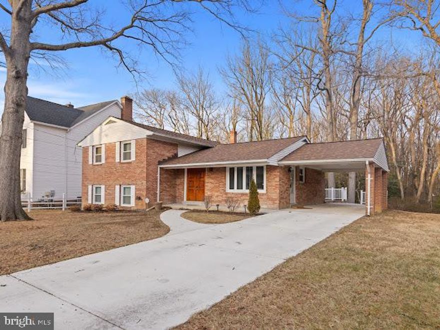 $10,000 Grant Available for qualified buyers purchasing as a primary residence through one of our trusted lenders.

DRASTIC PRICE REDUCTION FOR IMMEDIATE ACTION. Don't miss this great opportunity to own in this desirable area, a well-maintained cul-de-sac charmer, proudly enjoyed by the same owners for 40 years. This spacious 4-level split offers 4–5 bedrooms and 3 full bathrooms, providing versatility for today’s living needs. A gleaming stone foyer invites you inside, where hardwood and tile flooring flow seamlessly through the main level. The bright and open living room leads just three steps down to a warm and inviting sitting area featuring a cozy wood-burning stove, perfect for chilly evenings.

The kitchen boasts ceramic tile floors and sleek stainless-steel appliances. The lower level offers exceptional flexibility, including a rear entrance, full bathroom, and a potential 5th bedroom, ideal for guests, extended family, or an independent living space.

Enjoy peace of mind with major recent upgrades: new roof (2025), carport (2024), front sidewalk (2024), redesigned front porch (2024), refinished hardwood floors on the main and upper levels (2025), new carpet in family room (2025), and washer/dryer (2018). Abundant storage throughout the home adds even more convenience.

Step outside to your deck and private yard, an entertainer’s dream with plenty of room for gatherings, gardening, or relaxing under the trees.

The location is unbeatable! You’re just a short walk from the park, community center, and fitness center, making everyday living effortless and enjoyable.

Don’t miss your chance to own this exceptional, lovingly cared-for home that truly has it all!