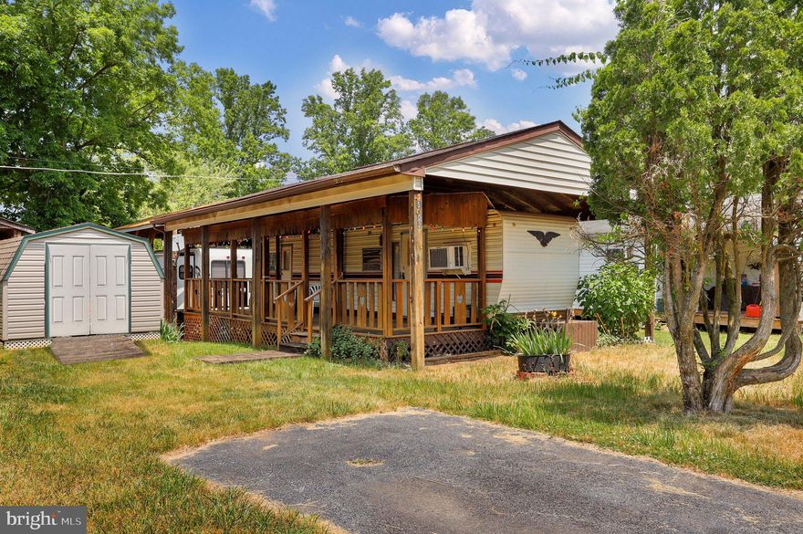 Welcome to your vacation home away from home located at Block 15 Lot 2 Yogi Bear Blvd in Riverbends seasonal campground, open April 1 - November 1 .  
1980's 35 Ft skylark camper with a nice spacious deck and pavilion on SEWER  (No pump outs) and at this location you are close to all the fun. Sit on your deck and watch the famous fire work show and enjoy camping living. All the amenities are included in the yearly dues of $1,525. Amish built shed on the property and lawn mower convey. 
12 Miles of deep water on the Potomac River access for boating, fishing & swimming. Yearly membership includes water, sewer, electric, trash and the park amenities such as 3 pools, putt putt, basketball, tennis, fireworks, car show, carnival, restaurant, playground, ball field and much more. Bring your golf carts, water toys and come enjoy life!