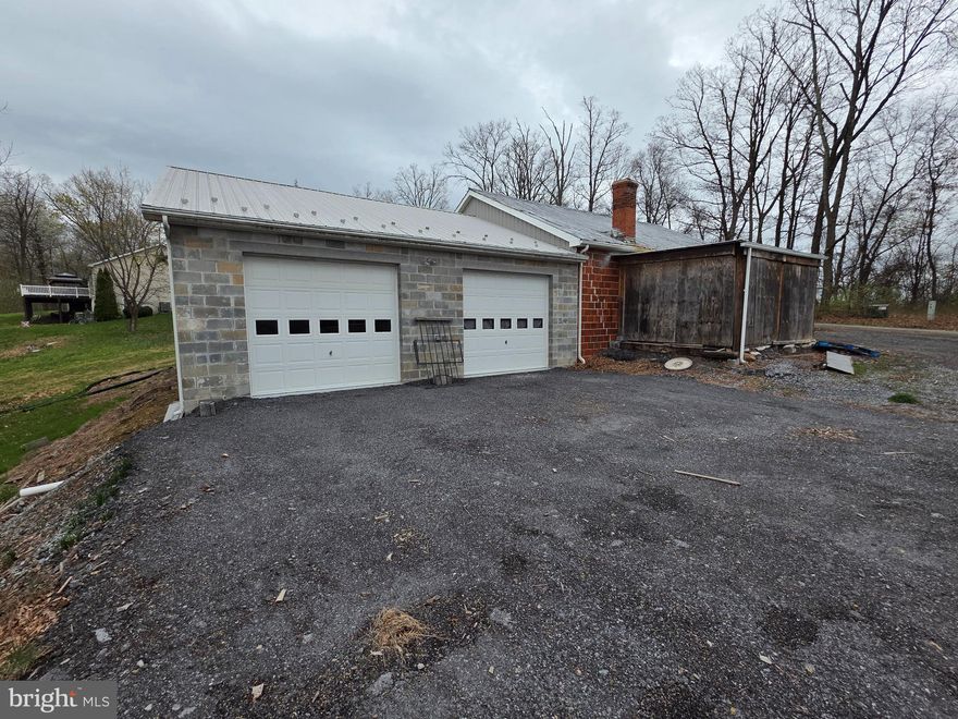 Rare opportunity to find unrestricted land in Hedgesville, just outside the Hedgesville City limits with no HOA. Parcel contains 3.4 +/- acres on Potato Hill st with a 36x75 building and views over looking the town of Hedgesville. All personal contents will be removed including storage container. The automotive lift may convey with full price offer. Buyer to pay transfer fees.