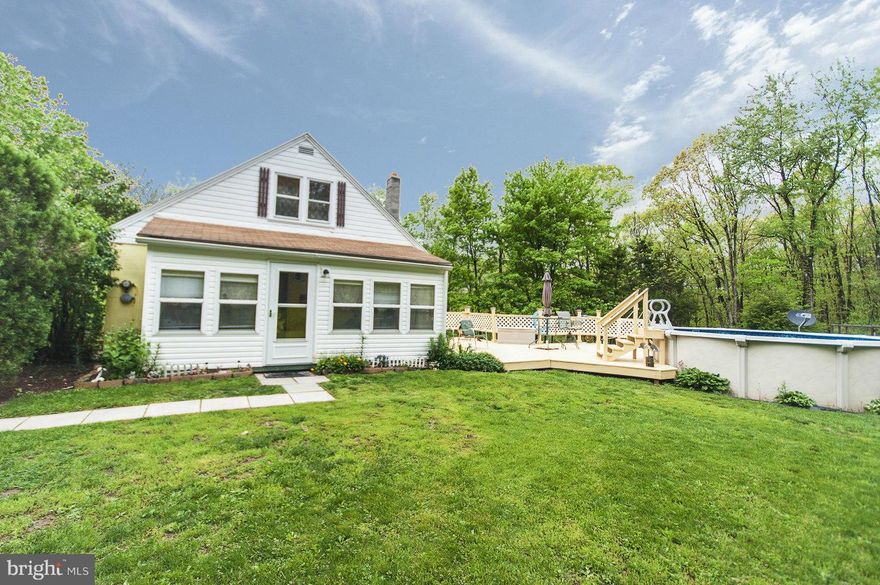 A Sparkling Gem! take a look at this well maintained home, nice wood floors, sun room, den. 3 bed, 1 bath, newer furnace, new windows, wood stove, bright kitchen with newer appliances. Clean dry basement. Close to Berkeley Springs , paved drive, private setting, level yard, patio style deck connecting the new pool. Out buildings in good shape and unrestricted This one will make you smile!