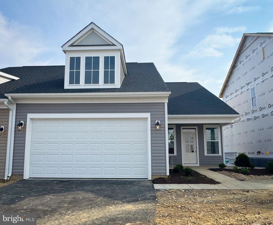 Brand new, single level Hemingway with 10 year builder warranty is now ready for move in at  Hiatt Pointe at Snowden Bridge, an active adult community for those 55 or better!!
Tranquil living awaits in this luxurious garden home, ideally set on a premium, wooded lot that backs directly to a private farm, offering expansive open space and serene views. The sleek, open-concept design seamlessly connects the stunning kitchen, featuring an upgraded stainless steel appliance package and Carrara Morro quartz countertops, to the dining and family rooms—perfect for entertaining. LVP flooring flows throughout the entire home, ensuring both durability and a cohesive aesthetic. Enjoy the outdoors from your inviting front porch or extend your living space onto the rear screened-in porch, ideal for relaxing.
The main level features a spacious primary suite with a walk-in closet and a luxurious primary bath with upgraded cabinets and a modern shower, complete with a seat and a frameless shower door. A second bedroom, a full bathroom, and a conveniently located laundry room are just steps from the two-car garage, making everyday tasks a breeze.
Located in Hiatt Pointe at Snowden Bridge, a new gated community for those 55 or better!will offer a gated entrance, bocce & pickleball courts, clubhouse with event room, fitness and yoga studio, outdoor kitchen with gas grill and an outdoor pool with hot tub. Snow, trash and recycling included.