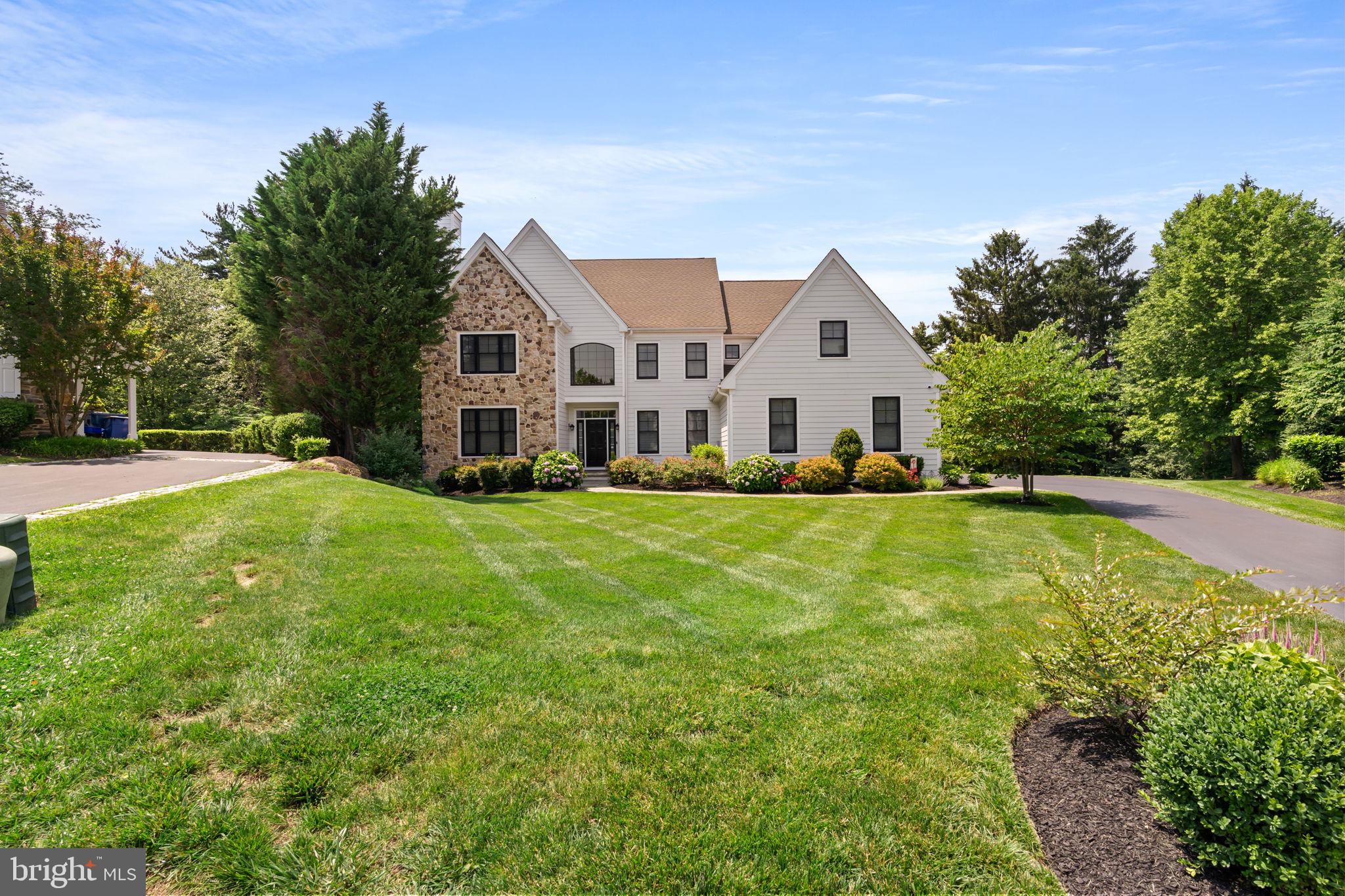 Welcome to 633 Edgewater Drive in West Chester, located in the highly coveted Edgewater community. This meticulously maintained home sits at the top of a quiet cul-de-sac, ensuring a peaceful and serene environment. With 6 bedrooms, 5 full/1 half baths, and nearly 6,000 square feet, this home offers luxurious space and exquisite finishes throughout.
Step through the front door and you’re greeted by the main entrance which opens into a large cathedral ceiling foyer and open dining room with tray ceiling. The family room has an enormous two-story window which floods the first floor in sunlight. The recently remodeled, oversized kitchen has a two-sided fireplace into the family room, an eat-in space, and looks out onto a like-new covered deck overlooking the Fern Hill Reservoir, where it is common to see deer, red fox, and bald eagles. Off the kitchen sits a beautiful powder room, mudroom with laundry, and access to the three-car garage. Additionally on the first floor is a living room/bedroom suite with a gas fireplace and an ADA-compliant full bathroom with walk-in shower--perfectly suited for an in-law suite. A study and an airy sunroom complete the first floor.
Traveling upstairs there are four bedrooms, including a large primary bedroom suite with dual walk-in closets, a dressing room with seating area, and a fully remodeled ensuite bathroom. The new ensuite bath includes all of today’s modern luxuries--a free standing soaking tub, dual head shower, double vanity, and radiant heated floors.
Heading to the lower level of the home, you'll find a true walk-out basement with sliding doors to a private stone patio with fire pit. Custom built-in storage add to the functionality of the huge open entertainment area, along with a wet bar/micro kitchen—ideal for entertaining. The lower level also has a gorgeous full bathroom with walk-in shower and an additional bedroom which would be perfect for out of town guests or an au pair. Oversized windows allow ample light to flood the space. A separate mirrored exercise room complete the lower level.
The exterior of the house has been updated with modern black windows, Hardie Board siding, established landscaping and thoughtful hardscaping throughout. The vaulted covered deck with a brick gas fireplace, ceiling fan, and heaters from above allow you to enjoy this space year-round. Hosting gatherings with your friends and loved ones will be an absolute pleasure with the built-in grill/kitchen. This home is one of the largest in the neighborhood and the location cannot be beat. Sitting just northeast of West Chester, across from the YMCA, near Chester County Hospital, and all of the wonderful shopping and dining downtown West Chester has to offer. To top it off, enjoy the award-winning West Chester School District. This home cannot be missed, all you need to do is unpack your bags. Schedule your tour today!