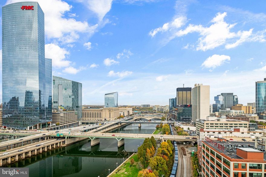 Highest floor offered for resale since One Riverside Condominiums was completed for occupancy in Spring, 2017. Many upgrades and customized details highlight this 3 bedroom, 2.5 bath home with valet parking space, wide plank Walnut floors, terrific storage, built-in custom millwork, 10' ceilings, and customized closets. Spacious living room and dining area with West and North exposures, great for entertaining with two custom temperature-controlled wine display cases and door to North facing terrace. Deluxe eat-in-kitchen with Miele appliances, Amazonia granite countertops, Sub-Zero wine refrigerator, wall oven and microwave. One bedroom is currently used as a home office with custom wood bookshelves and views of the river, bridges and Art Museum. 2nd bedroom with great storage and en-suite marble bath with stall shower. Laundry room off the hall with storage and laundry sink. Oversized bedroom suite with large sitting area, 4-piece marble bath with large infinity Whirlpool bathtub, large stall shower with two shower heads and great walk-in-closet with custom cabinets and shelves. Tax abatement through June, 2027. One Riverside is an award-winning luxury condominium with full-service amenities, including 24-hour concierge, 24-hour valet parking, and large, sunny fitness center with heated indoor 60' lap pool, Peloton bike, state-of-the-art equipment, locker rooms, saunas, steam rooms, and showers. Amenities also include catering kitchen, boardroom, guest suite, town car, and private, landscaped park and patio with outdoor grill. Wonderful location steps from Schuylkill River Park and Trail, close to University of Pennsylvania, HUP, Drexel, restaurants, shops, dog parks, 30th Street Station, Fitler Square, Rittenhouse Square, Cira Centre, Comcast Tower, public transportations and all Center City has to offer.