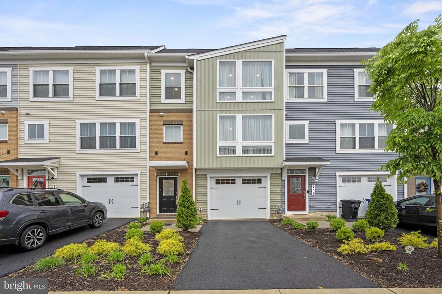Just STUNNING!  This 2 years new garage townhome is picture perfect and has all the upgrades and amenities you could ever want.  You can access the lower level either through the garage or front, where you will  find the great room that opens to the flat back yard.  The  main level open concept layout is light filled and private.  Enjoy the entertainer's dream kitchen with stainless steel appliances, granite counter tops, and a large island with overhang for barstools.  There is added seating in the dining area, and a half bath, plus a large pantry on this level.  You'll enjoy the living room with soaring ceiling, recessed lighting, and windows galore.  This level has a large deck for entertaining or relaxing.  There are 3 bedrooms and 2 baths on the upper level including the primary suite with a large walk in closet and  luxury bathroom with double vanity and walk in shower.  Residents enjoy access to community amenities such as Fitness Center and Pool. Enjoy carefree living with yard care, flowers, dog stations and more! Minutes from historic downtown Frederick where you can enjoy lots of Coffee shops, restaurants, and boutiques. Live nearby commuting routes, I-70, I-270 and Rt 15.