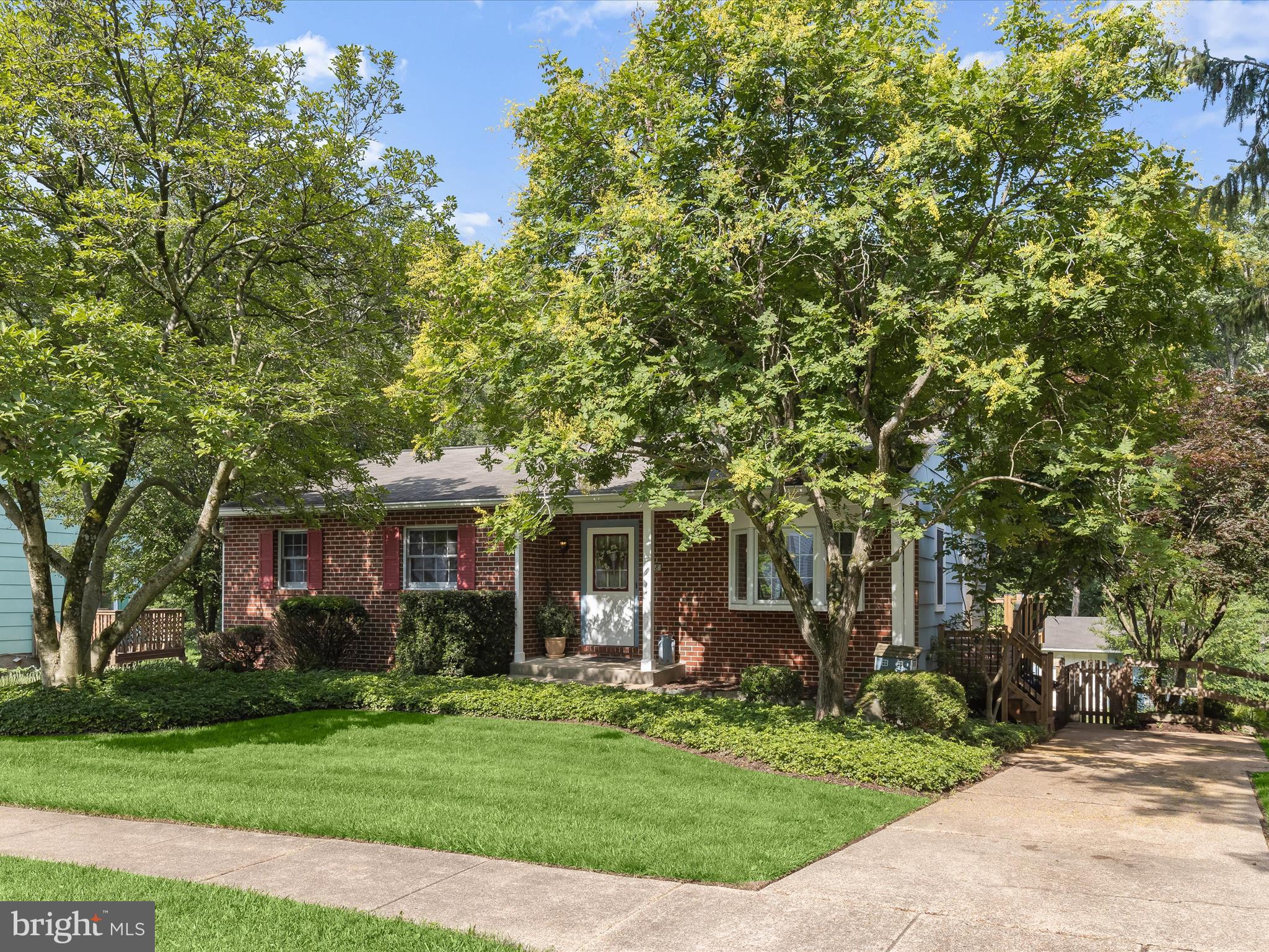 ***Multiple offers received. Deadline for all Highest & Best offers are due by 12:00pm on Monday, July 7th*** Welcome to this charming rancher in the desirable Woodbridge Valley community! Featuring a classic brick exterior, this beautifully maintained home invites you into a spacious living room with a bay window, crown molding, and warm hardwood floors that flow throughout the main level. The formal dining room continues the elegant trim detail with chair railing and crown molding, and offers direct access to a large deck, perfect for indoor-outdoor entertaining. The well-appointed kitchen boasts a breakfast bar, display cabinetry, ample storage, and sleek appliances to inspire your culinary creativity. The primary bedroom provides a serene retreat with double closets, a soothing neutral palette, and a private en-suite bath with a walk-in shower. Two additional bedrooms and a full hall bath complete the main level. The fully finished lower level offers endless possibilities with a spacious family room featuring ceramic tile flooring, access to the fenced yard, patio, and secure storage area. Additional highlights include a powder room, a spacious laundry room with ample storage, and a distinctive cleaning station equipped with shower attachments. Conveniently located near I-95, I-70, and I-695, this home offers easy access to major commuter routes and everything the region has to offer!