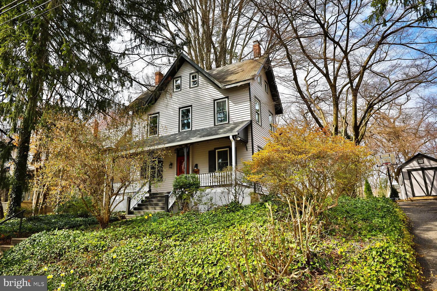 Welcome to Woodland Road, one of the prettiest streets in the historic neighborhood of Wyncote where unique and charming homes abound. This three storied treasure sits high with a welcoming front porch and transom front door. The circular flow of the first floor will lead you from the entrance hall into the living room, which is presently being used as a music studio and then into the heart of the home, the kitchen. This space beautifully combines old world charm with modern amenities. White quartz countertops and slate tiled backsplashes compliment the cabinetry and upgraded appliances; 5 burner gas range, under the counter beverage cooler, deep stainless steel sink with goose neck faucet, and an antique corner cabinet. Adjacent to the kitchen is a large laundry/ powder room combination that includes a coat closet. The comfortable family room with large game closet and sliders that exit to the lovely back yard, provides a cozy and inviting space. The generous dining room with ample natural light from the large windows are graced with built in cabinetry. Up the staircase you'll find a large flex space perfect for an office or second family room, along with a bedroom and hall bath featuring a claw foot tub. The third floor offers two additional rooms and a large full bath with stall shower, sky light and two double closets.
Additional updates include first floor hardwoods, new windows throughout and upgraded electric service (no Knob & Tube!). Located a short walk to the Jenkintown Train station and the popular Thomas William Park, local shops and a convenient drive to Center City, this home offers charm and convenience.