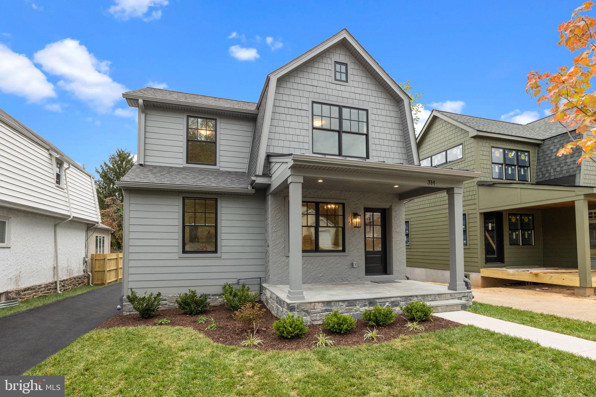 Welcome to this beautifully renovated Narberth home, thoughtfully designed and luxuriously remodeled by Sposato Homes. Step onto the open flagstone front porch and enter an elegant foyer featuring wainscoting extending to the dining room and up the main staircase. The first floor of the home offers a sunny bonus space with 2 windows, perfect for an office, music room or whatever your heart desires. The elegant dining room leads into a stunning chef’s dream of a kitchen with 8 foot island and quartz counter tops, Thermador appliances including a 36” built in range, a breakfast area, and an additional pantry to streamline organization. The kitchen flows into the living room/family room with a gas fireplace and lots of bright open space to enjoy with family and friends. This level has hardwood floors throughout. Off of the living room/family room find a convenient mudroom which leads to the back deck and yard, newly fenced and ready to enjoy. Downstairs find a finished basement offering additional living space and a powder room. Up the wide wainscoted stairs awaits your primary suite, a private sanctuary with hardwood floors, walk-in closets, an ensuite bathroom featuring a walk-in shower, and a peaceful view of the back yard. On this level are three additional bedrooms, one with an ensuite, and a hall bath for the other two bedrooms, along with the laundry room. Meticulously designed for modern living, this home is truly like-new, rebuilt from the inside out with all new systems, roof, and Pella windows. You’ll enjoy living in the heart of Narberth Boro, just a short trek to the delightful downtown with shops, restaurants, the library, playground, train station, and events galore. Find true luxury, convenience and neighborly living in the heart of Narberth!