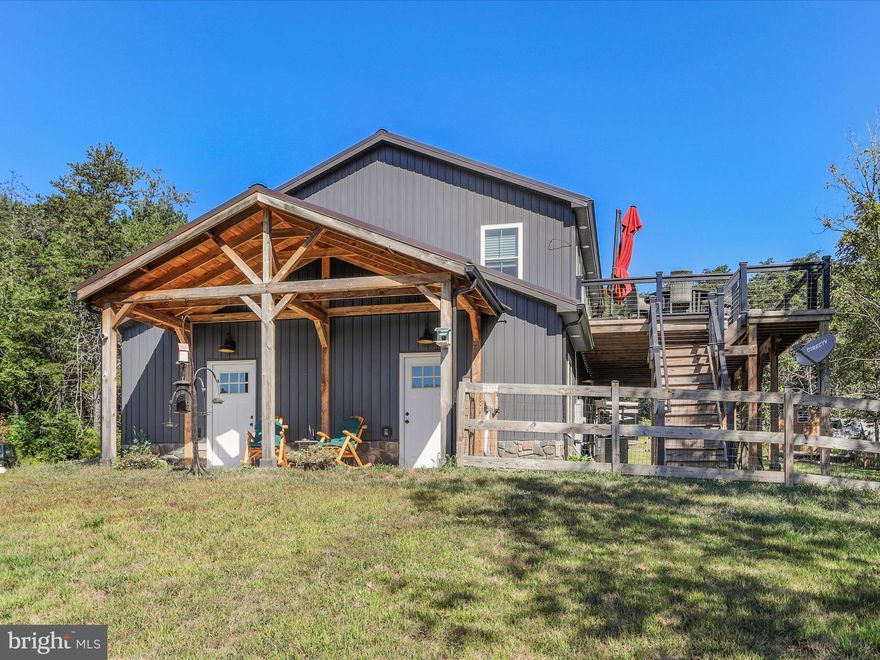 Stunning Custom-Built Home on 10 Acres with Mountain Views
Discover your dream home, crafted by a third-generation custom builder known for quality and attention to detail. This brand-new upscale residence sits on 10 private acres at the top of a hill, offering sweeping mountain, creek, and nature views—all just 5 minutes from downtown Berkeley Springs and minutes from state parks, the Potomac River, and the Virginia/Maryland state lines.
Key Features  
.• Spacious Layout: 3 bedrooms and 2 full baths in the main home, plus a separate in-law suite apartment with 1 bedroom, 1 bath, and private entry over the 3 car garage.

• Chef’s Kitchen: Gourmet design with stainless steel appliances, granite countertops, and upscale flooring.

• Multiple Living Spaces: Three family rooms—two in the main home (including a walkout level with a gas fireplace) and one in the in-law suite.

• Luxury Finishes: Upscale bathrooms, media room, custom barn doors, stone fireplace (just completed), and quality craftsmanship throughout.

• Convenience: Laundry rooms on both levels, a 3-car garage, and a whole-house generator.

• Outdoor Living: Expansive deck perfect for cookouts, entertaining, or simply enjoying million-dollar views.

Location Highlights

• 5 minutes to downtown Berkeley Springs dining, shopping, and entertainment.

• 2 minutes to the Virginia state line.

• 15 minutes to Maryland.

• Close to state parks and the Potomac River for outdoor recreation.

This home is the perfect combination of privacy and convenience—a luxury retreat surrounded by nature, yet close to everything. With 10 acres of stunning land, high-end finishes, and unmatched craftsmanship, this property is ready to impress. "