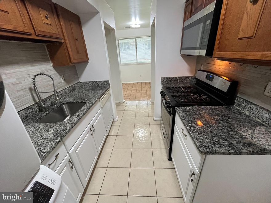 2 bedrooms, 1 bathroom, 2 level unit with garage access! 
Granite countertops, modern flooring throughout, newly painted, newer central AC, washer & dryer, dishwasher and over range microwave; modern amenities.