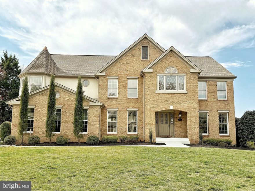 - Home Under Contract. Open House Cancelled. -
Stunning French Colonial in Prime Location
Located in one of the most desirable neighborhoods in Ashburn, this exceptional home boasts over 5,100 finished square feet of luxury living space. The oversized 2-car side-load garage adds convenience, while the expansive layout is perfect for both relaxation and entertainment.

Main Level Features:
-Newly installed LVP flooring throughout, including the stairs
-Open-concept kitchen with an eat-in space and butler's pantry
-Private office with built-in bookshelves for a cozy, productive space
-Gas fireplace and vaulted ceilings creating a warm, inviting atmosphere
-Stunning foyer creates the perfect first impression for guests

Renovated Basement:
-Complete renovation with premium tile floors throughout
-Bedroom with attached full bath
-Recreation room perfect for entertainment
-Additional washer/dryer hookups
-Kitchenette with breakfast bar
-Private entrance, making this basement feel like its own apartment

Upper Level Features:
-Four spacious bedrooms, each with an attached bathroom for ultimate privacy
-Fresh, new carpeting throughout the upper level
-Master bedroom with vaulted ceiling and walk-in closet with attached cedar closet
-Master bathroom complete with a luxurious jacuzzi tub for ultimate relaxation

Exterior Features:
-Extensive landscaping
-Fully fenced  backyard
-Two story deck with separate entrances to basement, family room, kitchen, & mudroom
-Premium corner lot nestled between two cul-de-sacs

With an exceptional layout, modern upgrades, and plenty of space for everyone, this stunning French Colonial is a true gem. Don’t miss the chance to call this beautiful house your home!