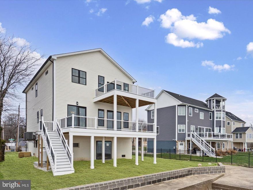 New construction home offering an open and versatile floor plan with 10 ft ceilings on the main level and walls of windows that capture panoramic, unobstructed views of the Chesapeake Bay and Bay Bridge. The Bayfront primary suite includes a private walk-out balcony on the double-decker deck, a tray ceiling, oversized walk-in closet, and a spacious spa-inspired bath with waterfront views. This home features 5 bedrooms and 2.5 baths, including a main-level office/guest room that can serve as the 5th bedroom. The kitchen is designed for entertaining, with a 36" gas range, 42" cabinets, large center island, double wall oven/microwave combo, and a huge HIDDEN walk-in pantry providing exceptional storage.
Additional highlights include: Wide open main level floor plan with multiple sliding doors and expansive windows Double-decker decks with sweeping Bayfront views Luxury finishes throughout
Prime location on Millers Island, close to local dining, waterfront bars, and recreational amenities
Enjoy luxury waterfront living with unmatched views and modern design in a sought-after community.