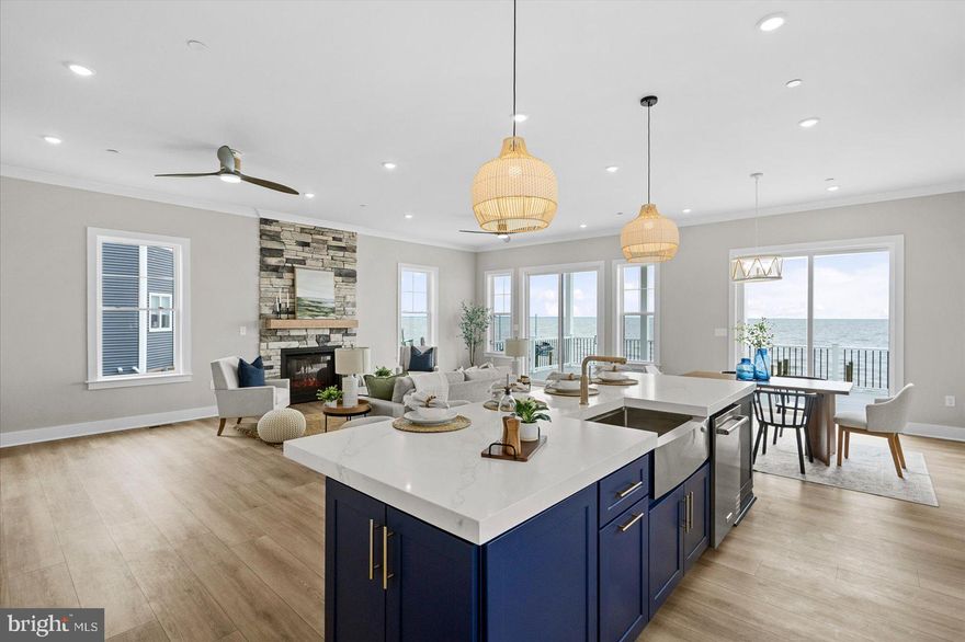 New construction home offering an open and versatile floor plan with 10 ft ceilings on the main level and walls of windows that capture panoramic, unobstructed views of the Chesapeake Bay and Bay Bridge. The Bayfront primary suite includes a private walk-out balcony on the double-decker deck, a tray ceiling, oversized walk-in closet, and a spacious spa-inspired bath with waterfront views. This home features 5 bedrooms and 2.5 baths, including a main-level office/guest room that can serve as the 5th bedroom. The kitchen is designed for entertaining, with a 36" gas range, 42" cabinets, large center island, double wall oven/microwave combo, and a huge HIDDEN walk-in pantry providing exceptional storage.
Additional highlights include: Wide open main level floor plan with multiple sliding doors and expansive windows Double-decker decks with sweeping Bayfront views Luxury finishes throughout
Prime location on Millers Island, close to local dining, waterfront bars, and recreational amenities
Enjoy luxury waterfront living with unmatched views and modern design in a sought-after community.