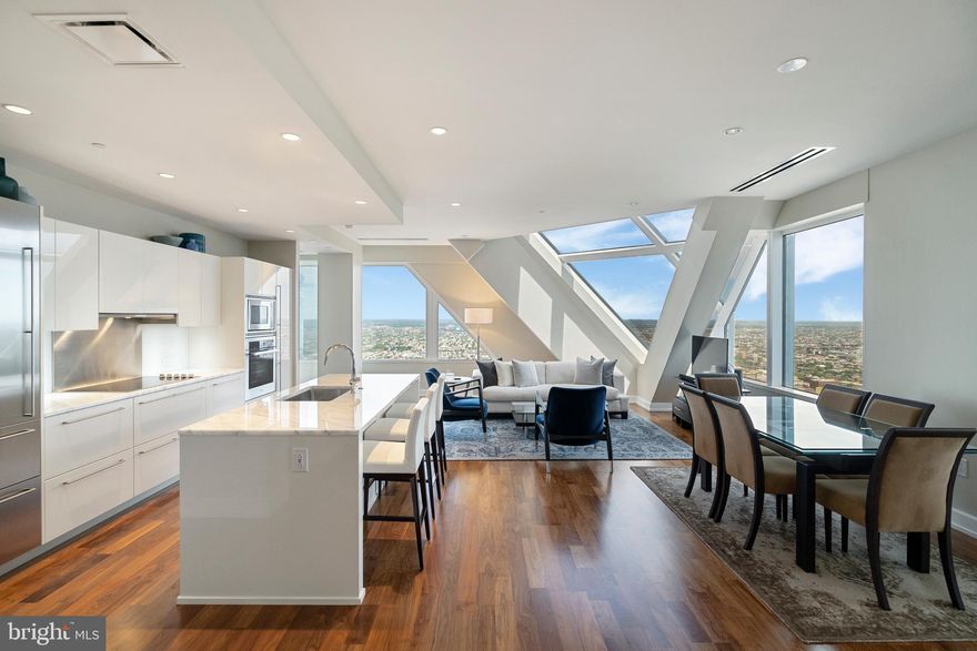 THE VIEW BELONGS TO YOU - Enjoy breathtaking panoramic skyline views from this three bedroom, three and a half bath residence in the sky.