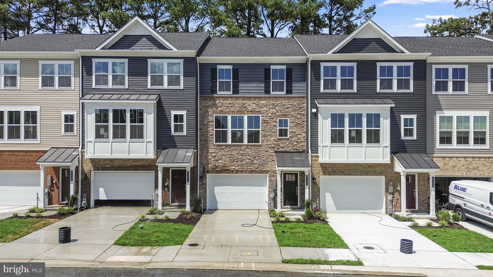 Stone-accented townhouse, newly built in 2025, offering 2,200 square feet with 4 bedrooms, 3 full baths, 1 half bath, and a 1-car garage—now available for lease in the peaceful community of Millersville. Enter into the lower level, where you’ll find garage and exterior access, a storage area, and a private guest bedroom complete with its own ensuite bath. Upstairs, the open-concept main level showcases an expansive living and dining area filled with natural light, complemented by a convenient powder room. The stunning eat-in kitchen features an island with bar seating and pendant lighting, stainless steel appliances, a timeless white subway tile backsplash, ample cabinetry and counter space, and a sunny breakfast nook with exterior access to the deck. The upper level offers a laundry area, three carpeted bedrooms, and two full baths, including the luxurious primary suite with a spa-inspired bath featuring a glass-enclosed shower with built-in bench seating and a dual sink vanity. Outdoor living includes a deck with a privacy wall and a fenced backyard—perfect for relaxing or entertaining.