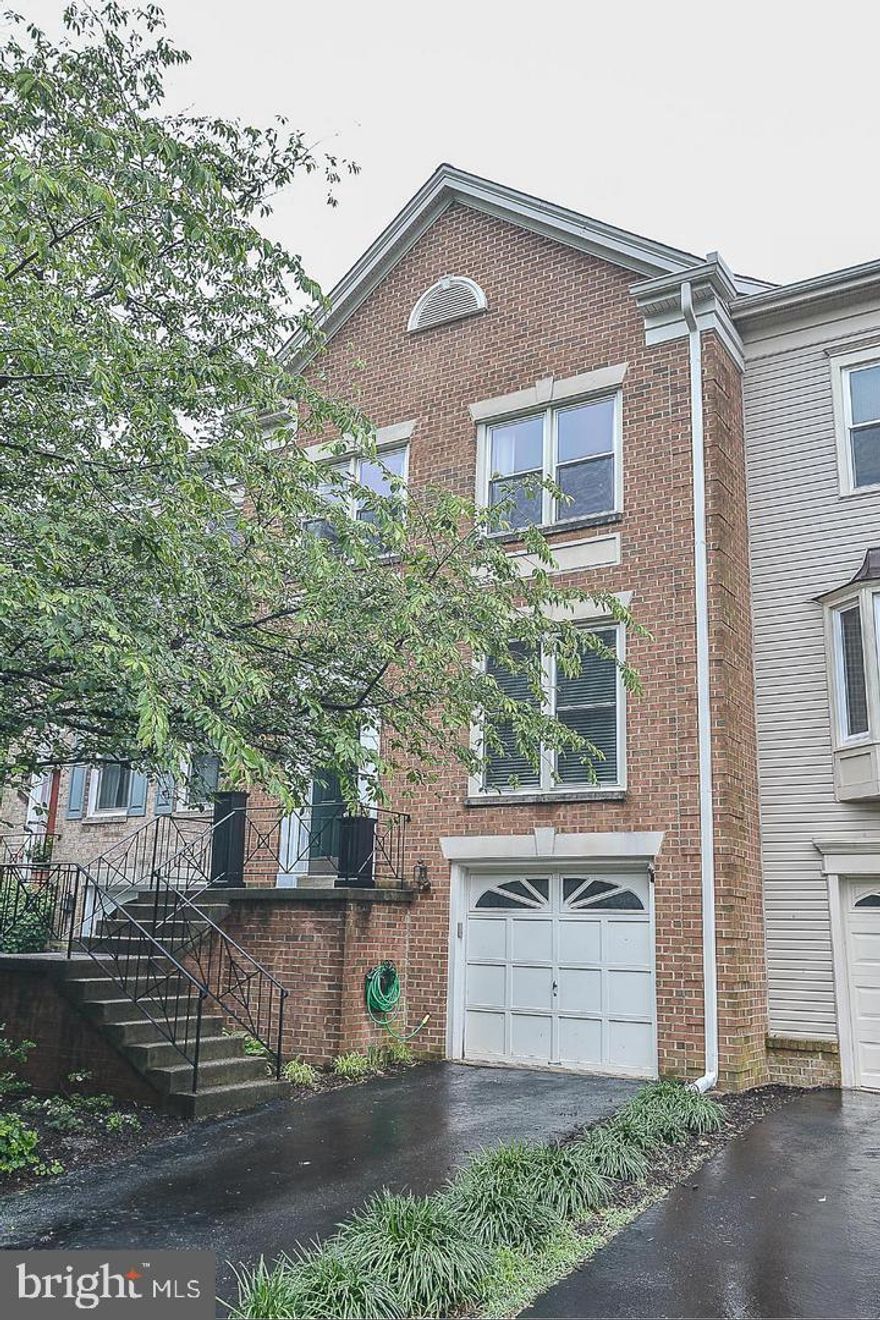 3 BEAUTIFULLY FINISHED LEVELS with hardwood floors throughout main level. Updated sunny kitchen with island,  granite and newer appliances.   Open dining room with step down to oversized living room enhanced by wood burning fireplace  french door to deck, and recessed lighting.  Primary suite w/luxury bath, including separate shower and soaking tub! Big Rec/Family Room with french door to fenced in back yard and full bath with oversized shower. Newer HVAC and washer/dryer for lower utility bills. One car garage with new garage door plus parking for 2 in the driveway.  MUST SEE! Looking for good tenant with solid income and good credit