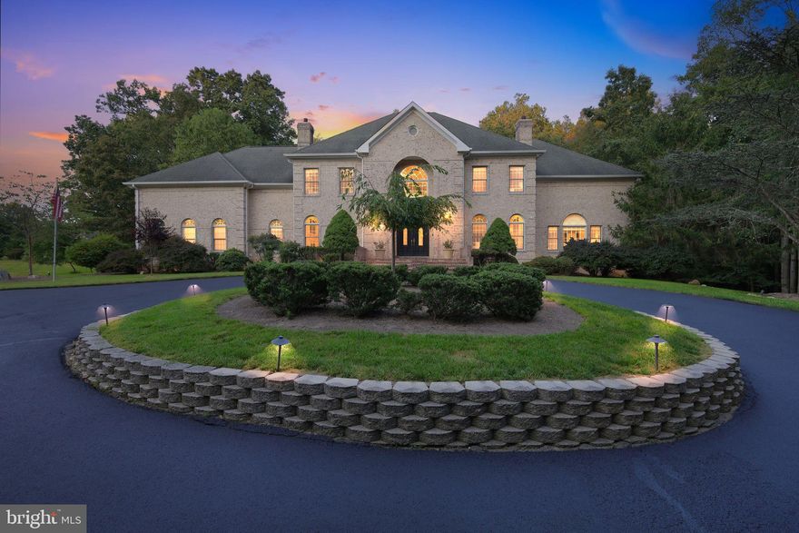 Luxury Redefined at 10409 Kingsbridge Rd., Ellicott City Experience the epitome of elegant living in this stunning custom brick estate nestled on over 4 acres of meticulously manicured land. Spanning nearly 10,000 square feet, this magnificent residence offers seven spacious bedrooms, six and a half baths, and an array of luxurious amenities designed for comfort, style, and entertainment. Upon arrival, be greeted by a grand two-story foyer that sets the tone for this exquisite home. The main level features a chef’s dream gourmet kitchen equipped with top-of-the-line appliances, a generous breakfast area, and a massive island—perfect for culinary masterpieces and gatherings. Step down into a sunlit sitting room overlooking the tiered deck and sparkling inground saltwater pool, creating an ideal indoor-outdoor flow for entertaining. The elegant family room boasts a striking brick fireplace and soaring two-story ceilings, while the formal dining and living rooms provide perfect spaces for hosting family and guests in style. The luxurious primary suite offers a private retreat, complemented by an opulent primary bath that exudes relaxation and sophistication. Upstairs, discover five large bedrooms, four full baths, and convenient access to expansive attic storage—ample space for family, guests, and all your needs. All TVs in every room are included, seamlessly integrated into the home’s modern design. The lower level is a true entertainer’s paradise, featuring a sophisticated wet bar, a pool table (conveying with the home), a spacious workout room with equipment included, and an incredible sauna—ideal for relaxation and recreation. Walk out from the lower level to a stunning stone patio, perfect for outdoor entertaining, overlooking the lush, private landscape. Additional highlights include recent updates such as a brand-new septic system (2023), pool equipment less than two years old—including pumps, heater, and robotic vacuum—and a serene, private setting that combines luxury and tranquility. This exceptional estate is a rare opportunity to own a truly magnificent home in one of Ellicott City’s most desirable neighborhoods. Privacy, elegance, and modern comfort await—