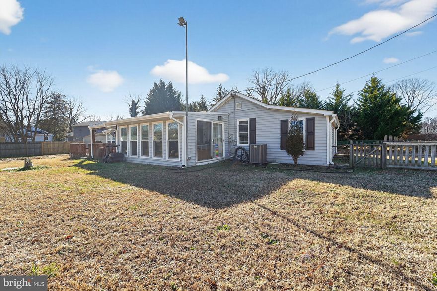 This charming 3-bedroom, 1.5-bathroom ranch-style home in Rock View Beach underwent major renovations in 2021, enhancing its appeal and functionality. Enter in through the kitchen which offers vaulted ceilings, ceramic tiles & recessed lights. There's a MASSIVE SunRoom off the kitchen with tons of sliders- perfect for family gatherings with tons of natural sunlight. The 3rd bedroom is filled with sliders and goes out to the covered deck. Set on a spacious 0.32-acre CORNER lot, the property boasts a large FENCED-IN side & backyard, ideal for outdoor activities. Enjoy the deck as it provides a serene space for relaxation. Bring your boat because this home is located just 1 block from Rock Creek, so you can enjoy fishing, boating and all that the community  has to offer. Rock View Beach is known for its friendly atmosphere and boat accessibility, making it a desirable neighborhood for all. ACT QUICK AT THIS PRICE!   Being sold-as is but upgrades include: New Roof, Septic, Doors & Windows and Front Steps!