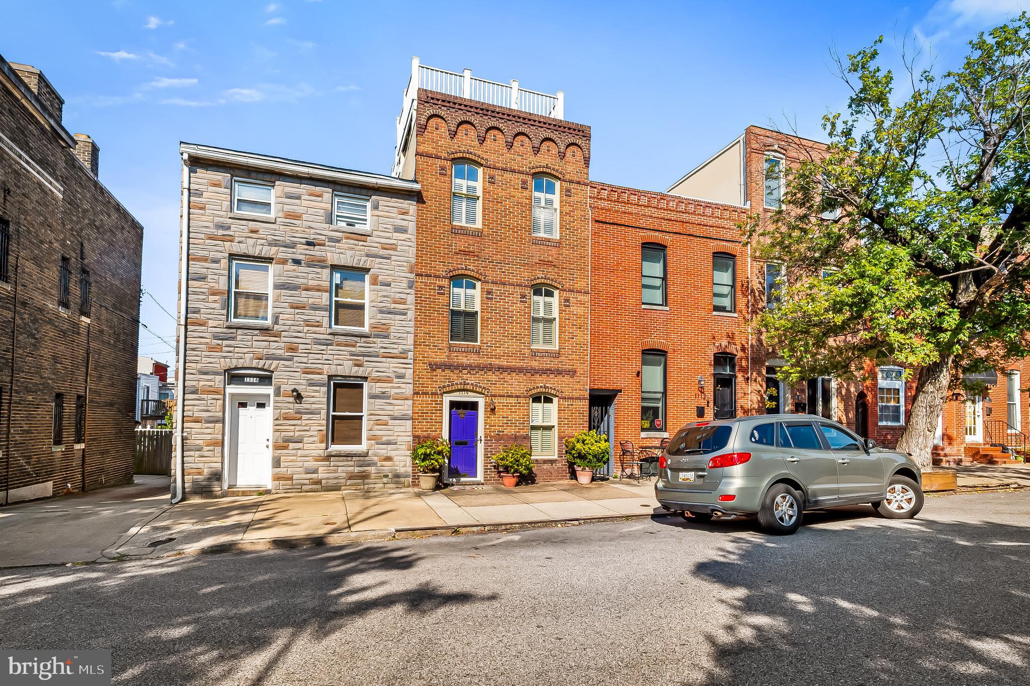 4 Levels of finished living space w/ 4 Large Bedrooms and 3.5 Baths above grade, a finished basement, rooftop deck & rear courtyard! *Charleene Doverspike reno. 14 ft. wide. Beautiful custom finishes throughout. Flooded with natural light from skylights, a central light well, and many transom windows. Gorgeous Cherry wood floors. Custom kitchen w/ pantry & island. Formal dining area. A wall of windows leads to the hardscaped courtyard. Note the front exterior brickwork and arched windows. Walk in closets, recessed lighting, tray & cathedral ceilings. Large finished basement for storage, home gym, or bonus room. Rooftop deck with scenic water and city views. Dual zoned HVAC. Tankless water heater. Too many bells & whistles to mention. Professional photos coming soon.