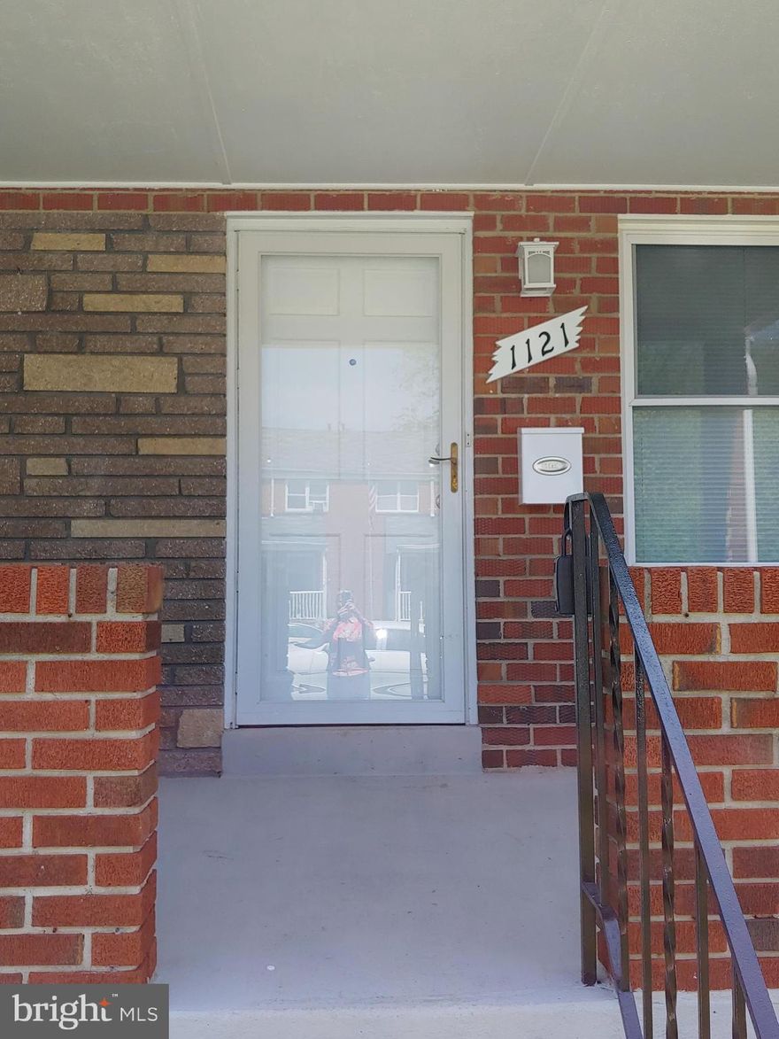 VOUCHERS ACCEPTED. Gorgeous completely renovated porch front townhome with 3 bedrooms and 2 full bath. Beautiful open kitchen with new appliances, cabinets and granite counters. Large second full bath in basement. Parking area in rear of home. Hurry this one won't last long!