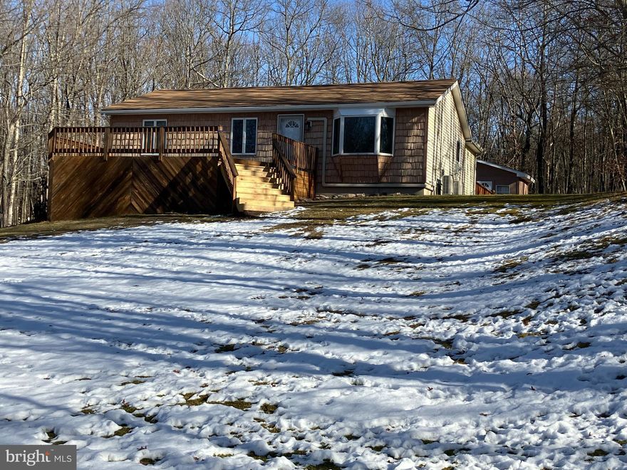 Oversized garage/shop with electric and huge ceilings, plus large storage shed,  huge front and rear decks - immaculately-maintained ranch with hardwood and laminate flooring, cook's dream kitchen with plenty of storage, granite countertops and stainless appliances, 2 mini splits for energy-efficient heat and air, located in gated STR-friendly community with security gates, lakes, pools, clubhouse, trash service and road maintenance