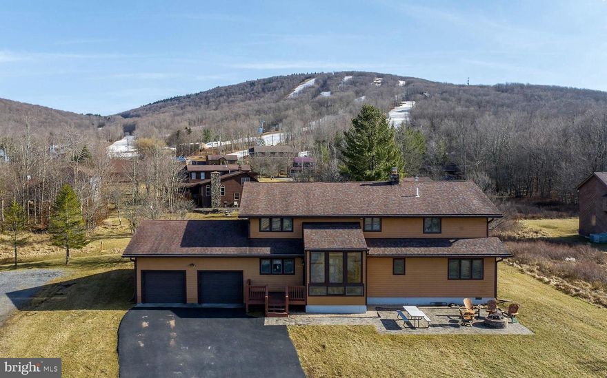 Enjoy the wide variety of recreational activities that Canaan Valley provides from this beautiful 4-bedroom home at the base of Timberline Mountain. This furnished property has a history of being a year-round rental with a 2-car garage, central air, and large yard while being in close proximity to the ski resort.  It is located on Timberline Road with views of the ski area from the back deck and hot tub.  Area activities include skiing, trout fishing, hunting, mountain biking, hiking, camping, horseback riding, wildlife viewing, and much more.  Area attractions include Timberline Mountain, Canaan Valley Ski Area (5 +/- miles), Blackwater Falls State Park (13 +/- miles), and Dolly Sods Wilderness Area.  The Blackwater River and Canaan Wildlife Refuge are minutes away along with thousands of acres of National Forest.  Deep Creek Lake, MD (45 +/- miles).  Washington D.C (175 +/- miles).  Pittsburgh, PA (143 +/- miles).