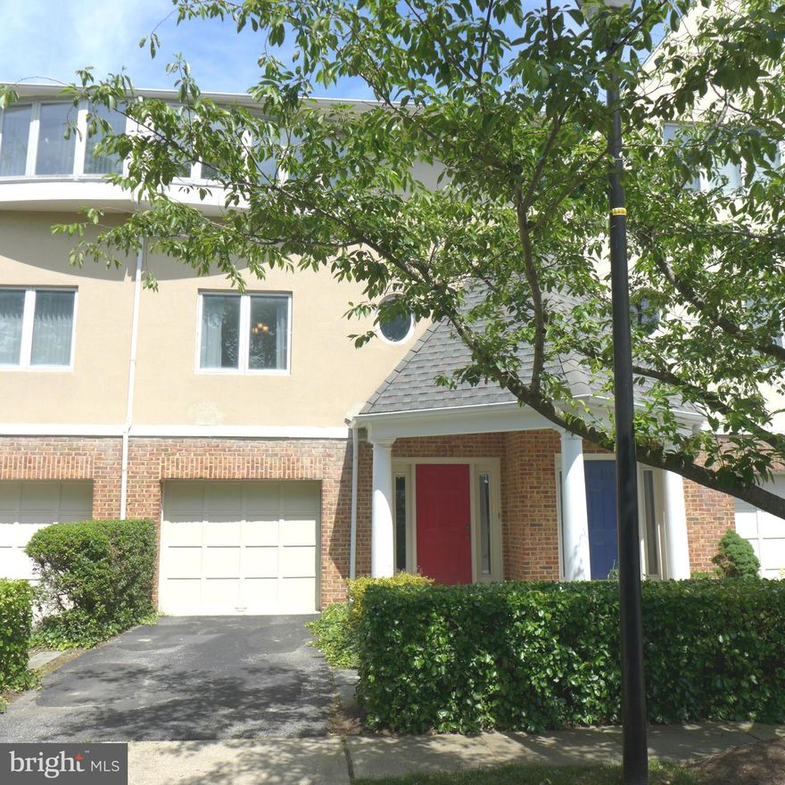Welcome to this beautiful garage townhome nestled in the quiet, gated community of the Villages of Homeland.  Enjoy hardwood floors throughout the main level, featuring a spacious living room with a wood burning fireplace and access to a private deck overlooking serene wooded views—perfect for relaxing or entertaining. The chef's kitchen boasts stainless steel appliances, granite countertops, and a charming built-in seating nook.  Upstairs, the primary suite offers an ensuite bath, accompanied by two additional bedrooms and a full hall bathroom. The versatile lower level can serve as a family room or a fourth bedroom and includes walk-out access to the rear yard, plus a dedicated laundry room.  Residents enjoy access to top-tier amenities including a community pool, fitness center, and shared meeting space. Yard maintenance and snow removal are included in the HOA. Ideally located within walking distance to Notre Dame and Loyola Universities, and just minutes from I-83, shopping, schools, and major commuter routes.   Home and carpet will be professionally cleaned.