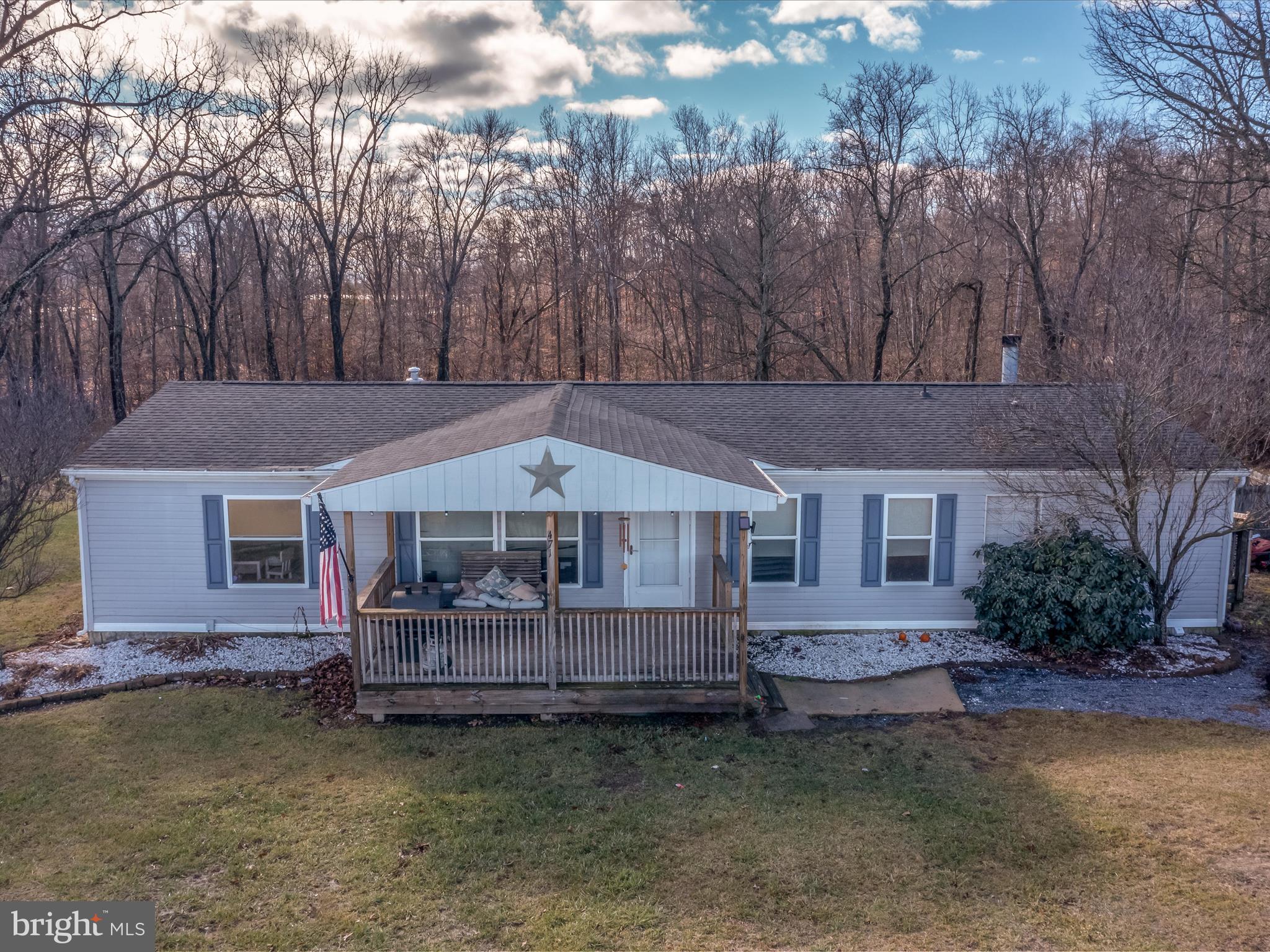 Unrestricted! Qualifies for VA, FHA or conventional financing! This 3 bedroom, 2 bath single level home has been well maintained. It is situated on over an acre of mostly level land. The home features a large covered front porch to enjoy your views. Inside you have a spacious living room with easy care laminate floors and vaulted ceilings. It opens to your dining room with laminate floor and decorative light fixture. The spacious kitchen features vinyl floors and oak cabinetry. You have vaulted ceilings and a large pantry. Down the hall you have a large family room with laminate floors, ceiling fan, and woodburning fireplace. The mud/ laundry room keeps your laundry machines tucked away. Bedrooms 1 and 2 features carpet and overhead lighting. Primary suite features carpet and overhead light. The large closet affords plenty of storage space. The private ensuite bathroom features LVP floors, single bowl vanity, 3 ft walk-in shower and a 5 ft soaking tub to enjoy after a long day. Outside you have a fenced portion of your rear lot, bring your pups! Beyond this you lot backs to mature trees and a nice creek. The property is topped off by a 2 car detached garage with concrete floors and electric. This home has everything you want and more! Come see it today!
