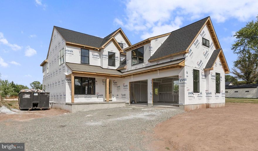 A brand-new home with stunning custom features, a finished basement, modern open layout, an acre of level land, and a convenient location in the Spring-Ford Area School District? 358 Limerick Center Rd has all of that and more. Purchase now to select your final personal finishes and move in before the end of the year!

Step inside to a bright two-story foyer and an open-concept main level designed for everyday living. The chef’s kitchen features an oversized quartz island, two-toned cabinetry, and a sunny morning room that flows directly into the family room. With 9-foot ceilings, a gas fireplace, and walls of windows, this space feels both warm and spacious. Upgraded details like wainscoting, trim work, and designer lighting add character rarely found in new construction.

A private home office with built-in shelving provides the perfect work-from-home setup, while hardwood floors run throughout the main level for a clean, cohesive feel.

Upstairs, the luxurious primary suite includes a spa-style bathroom, oversized walk-in closet, and a beverage/coffee bar—an unexpected touch that elevates daily living. Three additional bedrooms, a well-appointed hall bath, and a convenient second-floor laundry room complete this level.

Outside, the full front porch and expansive yard create endless opportunities for outdoor living—gardens, play space, or a future pool, all on your own acre of land.

The location is ideal: just minutes to Costco, Target, the Philadelphia Premium Outlets, restaurants, parks, and Route 422 for an easy commute.

If you're searching for a new construction home in Spring-Ford schools with upgraded finishes, modern design, and move-in-ready completion by year’s end, this is the one.