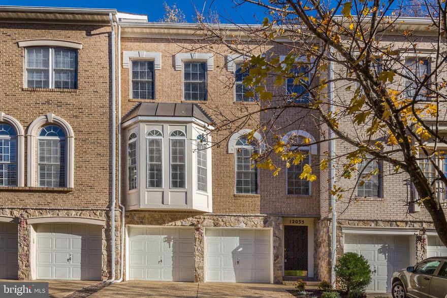 Beautiful Brick Townhome in Sought-After Tildenwood! This elegant three-level brick townhome is ideally located in the desirable Tildenwood community of North Bethesda. Offering timeless style, modern updates, and a fantastic floor plan for today’s lifestyle, it’s the perfect blend of comfort and sophistication. The sun-filled main level features hardwood floors, recessed lighting, and expansive floor-to-ceiling windows that fill the formal living and dining rooms with natural light. The updated gourmet kitchen boasts stainless steel appliances, a center island, white cabinetry with new hardware, and a pantry. It opens to a spacious family room with a gas fireplace, built-ins, and access to the rear deck—perfect for everyday living and easy entertaining. Upstairs, there are three bedrooms with vaulted ceilings and two full bathrooms. The primary suite offers a serene retreat with a spa-inspired bath and custom walk-in closet, while two additional bedrooms and a second full bath complete the upper level. The fully finished lower level adds wonderful versatility, featuring a second family room and a home office with a built-in desk and storage, as well as direct access to the two-car garage. Recent updates include recessed lighting on the main level, replaced deck and screen door, updated washer/dryer and kitchen appliances, freshly painted, window blinds, refreshed bath fixtures, replaced gutters with guards, a newly paved driveway, and enhanced landscaping—plus regular roof and HVAC maintenance for added peace of mind. Ideally situated near Tilden Woods Local Park—with its walking trails, playground, pickleball and tennis courts, softball field, basketball court, and picnic area—this home is also close to top-rated schools, two Metro stations, major commuter routes, and nearby shopping and dining. All the right updates, all the right spaces—set in a private, park-like community. Welcome home!