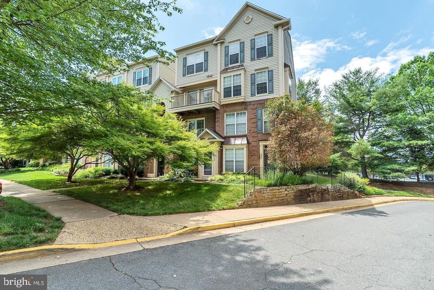 Spacious 2-Level 2 Bedroom 2.5 Bathroom, End Unit, Condo-Style Townhome In Very Desirable Village Community In Falls Church * Open Concept Floorplan * Inviting Foyer * Sun-Filled Living Room With Large Sliding Glass Door Wall Opening Up To Private Balcony * The Double Sided Gas Fireplace Breaks From The Living Room Into The Huge Formal Dining Area With Walls Of Windows And Crown Molding * Spacious Kitchen With Beautiful Maple Cabinetry, White Appliances, And Tons Of Countertop Space * Master Suite With Tray Ceiling, Large Walk-In Closet And Relaxing Bathroom With Dual Sinks, And Oversized Soaking Tub * Additional Master Suite With Large Walk-In Closet And Bathroom With Shower Stall * Full-Size Washer And Dryer On Bedroom Level * 1-Assigned Parking Space * Water, Sewer, And Trash Utilities Included * Just One Block From West Falls Church Metro Station * Easy Access To I-66, Dulles Toll Rd, Rt 7, Shops And Restaurants *