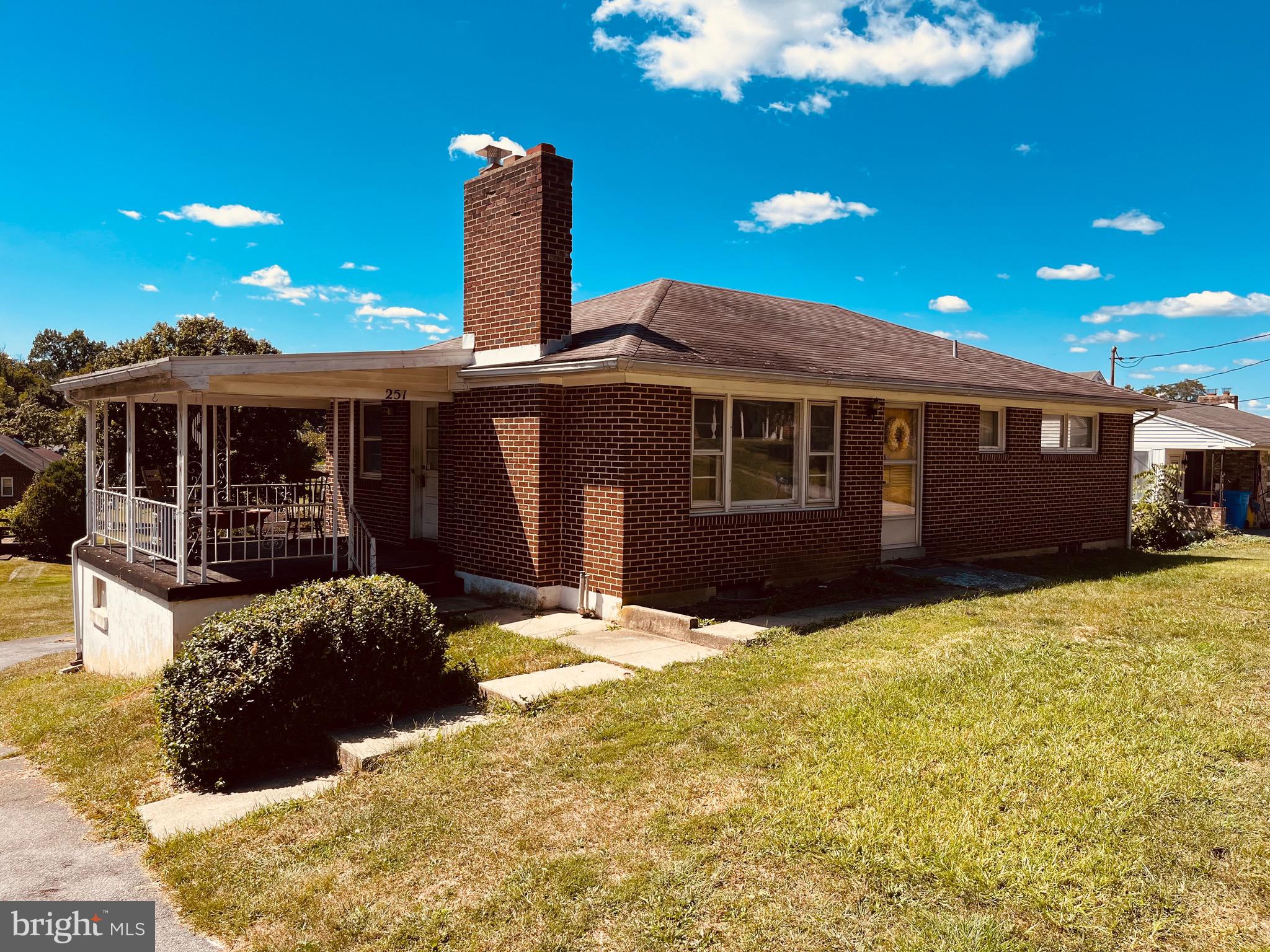 Bring your tools and bring this all-brick rancher back to life! Solid home needs TLC. This home features a decent size covered patio, eat in kitchen, spacious living room, full bath and 3 bedrooms on the main level. The fully exposed, walk out basement is partially finished and includes a large unfinished area as well as the 1 car garage. Large, level back yard. The furnace was replaced in 2020, and the home was hooked up to public sewer and water in 2016. Water heater was replaced in 2018, and a new chimney liner was installed in 2021. There are hardwood floors under the carpet and laminate.