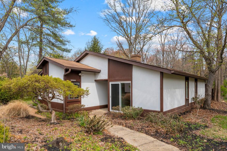 Tucked away on a peaceful, private lot in the heart of Columbia, this charming patio home offers the perfect blend of comfort and convenience. Inside, you'll find four spacious bedrooms and two full baths, all accented by classic parquet flooring and fresh, neutral paint throughout. The inviting living room boasts a cozy corner fireplace and oversized sliding doors that lead to a private wraparound deck—perfect for relaxing or entertaining with serene views of open space.

The light-filled kitchen flows into a flexible living area that’s ideal for casual gatherings or a generously sized dining space. The primary bedroom offers a quiet retreat with its own full bath and ample closet space.

Additional highlights include a one-car carport, a reserved parking spot, and an unbeatable location close to Columbia’s best shopping, dining, parks, and amenities.