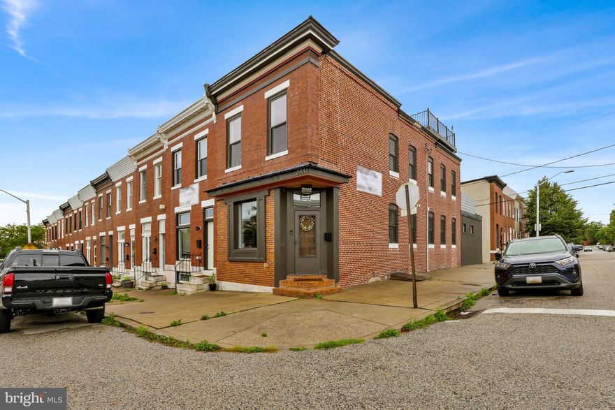 Huge corner home with garage. Walking distance to tons of restaurants, bars and shopping. Kitchen features a 10' granite island, high end SS appliances, 6 burner gas stove and 54" upper cabinets.  Basement boasts a tile floor, full bath, bedroom/ office and is perfect for a family room or workout space.  Upstairs features a massive master suite with WIC. The en suite completes the space with dual vanities. The shower features dual shower heads, 8' frameless shower, marble tile with glass inlay and slate shelf. The 2nd upstairs bedroom has it's own full bath. Upstairs laundry rounds out the space.  2 rooftop decks give you some of the best views in Brewer's Hill.