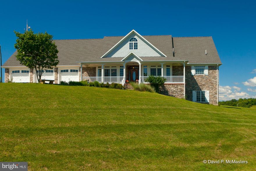 Exquisite Custom Contemporary Rancher features one level living at it s best!  Spacious front porch to relax and enjoys the long rang mountain views.  Step into the foyer and to your right will be an office with French doors to access the front porch.  To your left is a formal dining room with built in cabinet with granite counter top.  Leading from the dining room is a spacious Kitchen with granite counter top.  Completing the main area is an open Breakfast room and large great room with Stone gas fireplace.  Master Bedroom suite is situated on one end of the home, creating a spacious oasis that is large enough  to accommodate a sitting area as well as exercise equipment with large walk in closet and master bath that features a jetted tub plus a walk in shower.   Breakfast room, Great room guest bedroom and Master bedroom all lead to the 12 x 32 covered porch with stone floor where you can enjoy pastoral views.  The opposite wing of the home features 2 quest bedrooms, bath and laundry room that leads to a huge 3 car garage. Flooring throughout the home is Brazilian cherry.  Fronts a county road for easy access.  Hardiplank siding offers low maintenance exterior